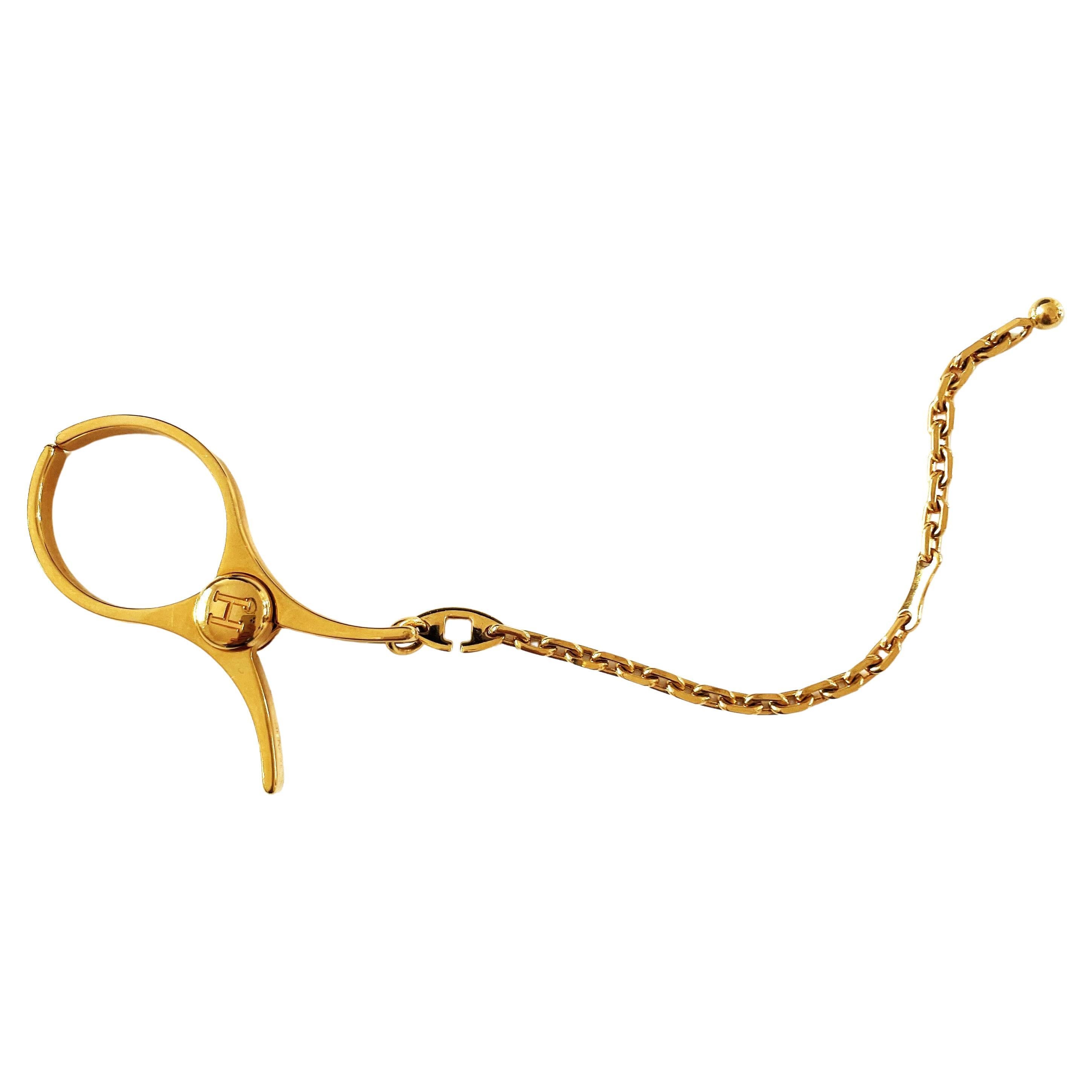 HERMÈS, breloque de sac à gants "Filou" en plaqué or, à collectionner