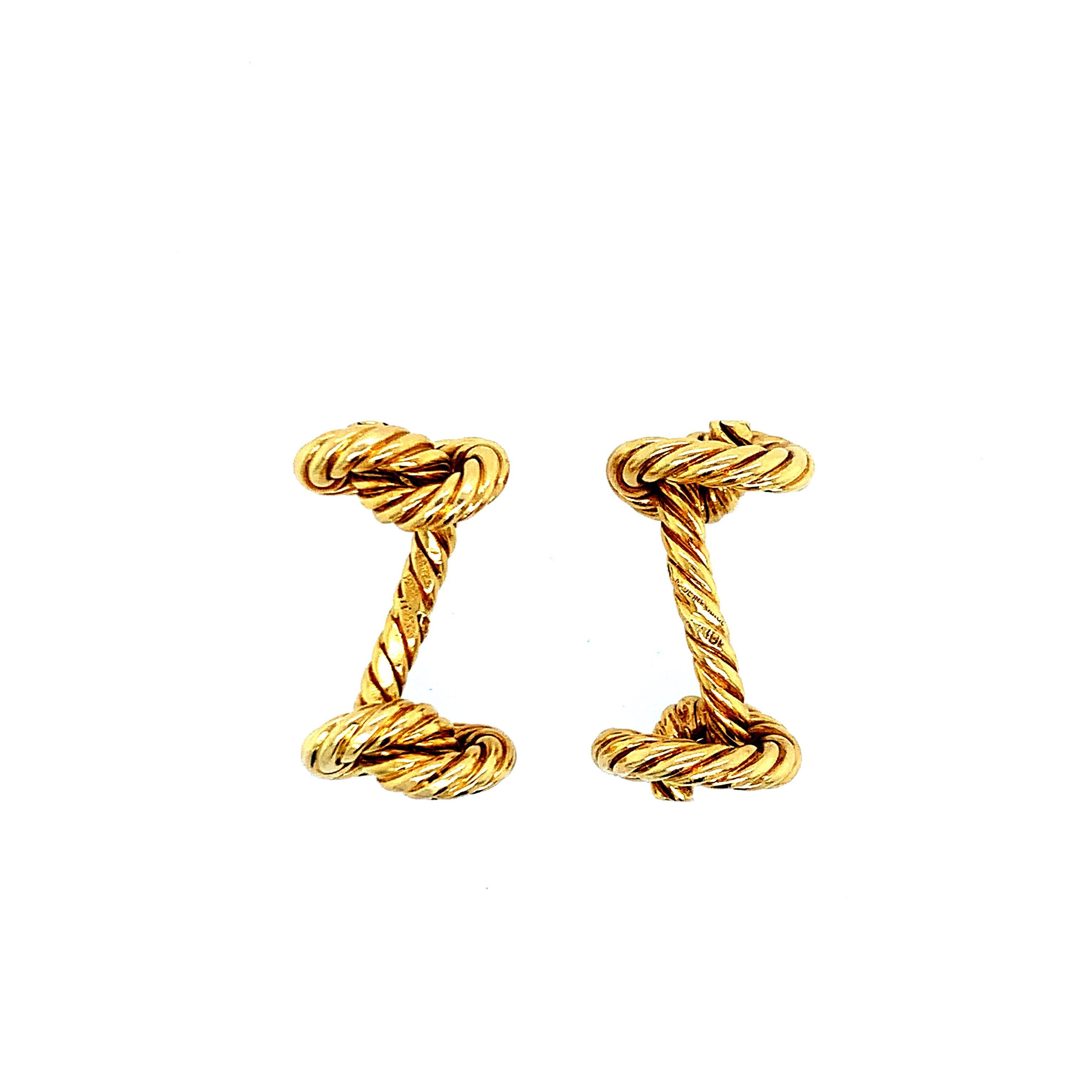 Created by Hermés, this 18 karat gold has a rope design with knots on each end. Total weight: 22.8 grams. Length: 2.7 cm. Made in Paris, France. 

Serial No. 70863.