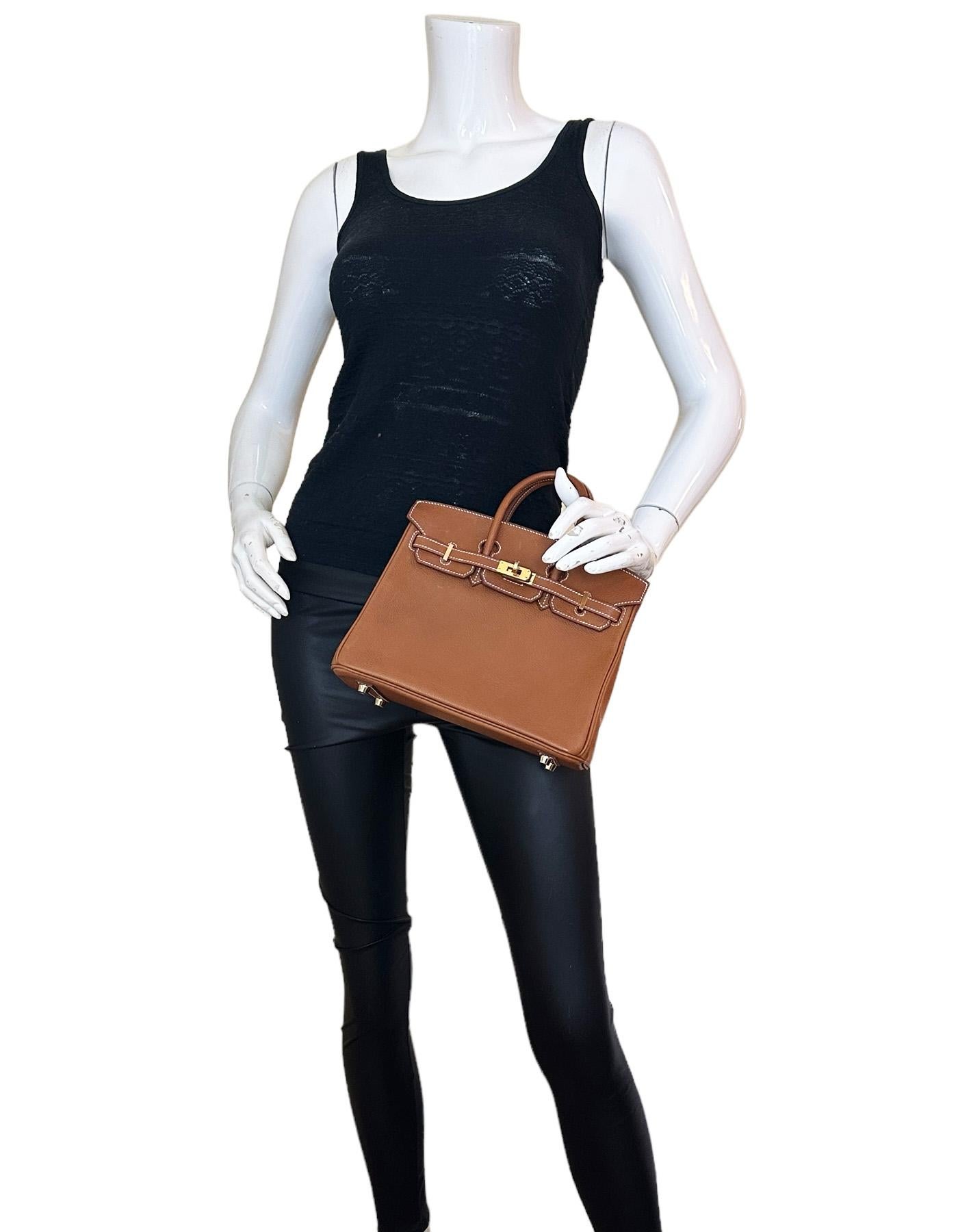 Hermes Gold Togo Leather 25cm Birkin Bag w/ Gold Hardware

Made In: France
Year of Production: 2019
Color: Gold- tan
Hardware: Goldtone
Materials: Togo leather
Lining: Chevre leather
Closure/Opening: Flap top with two draw strap closures and