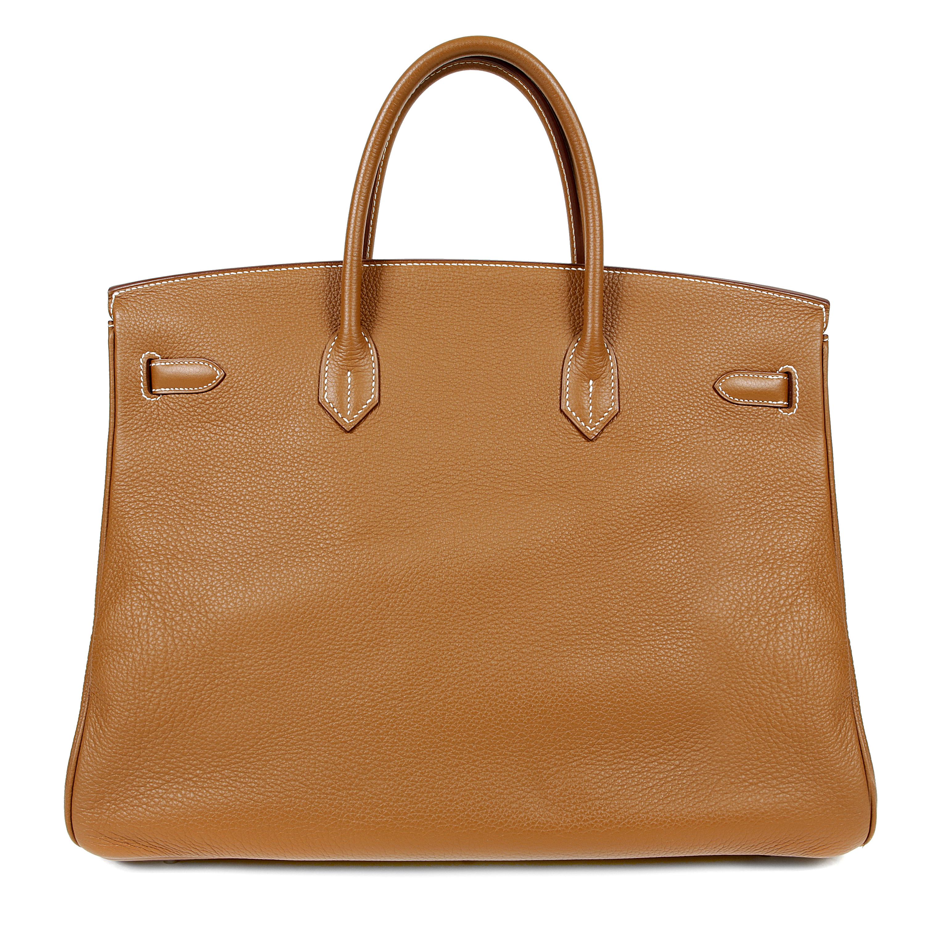 This authentic Hermès Gold Togo 40 cm Birkin is in excellent condition.    Hand stitched by skilled craftsmen, wait lists of a year or more are common for the Hermès Birkin. They are considered the ultimate in luxury fashion. Classic Gold paired