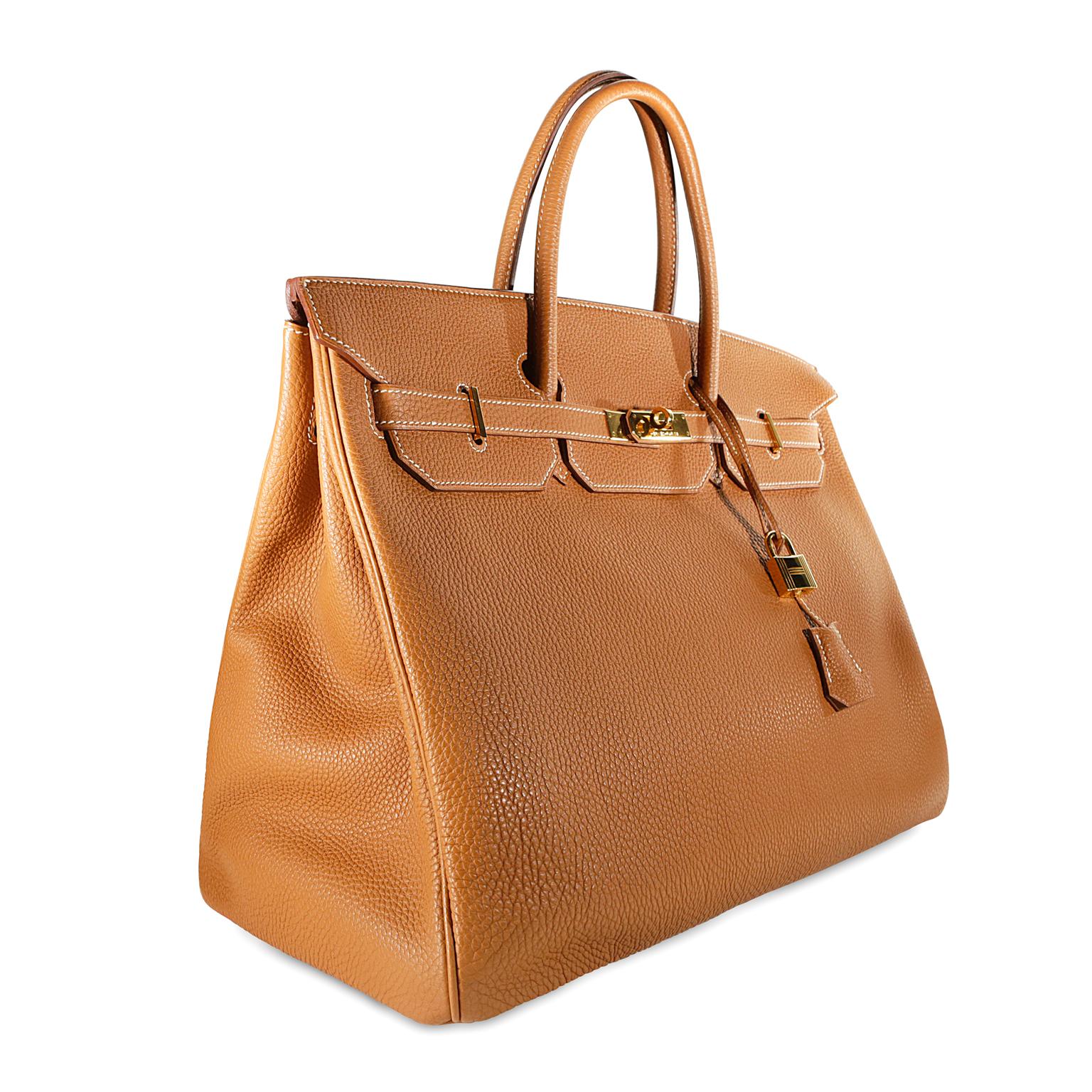 Hermès Gold Togo 40 cm Birkin - Excellent Plus Condition
Hand stitched by skilled craftsmen, wait lists of a year or more are not uncommon for the Hermès Birkin. They are considered the ultimate in luxury fashion. Classic Hermès Gold is remarkably