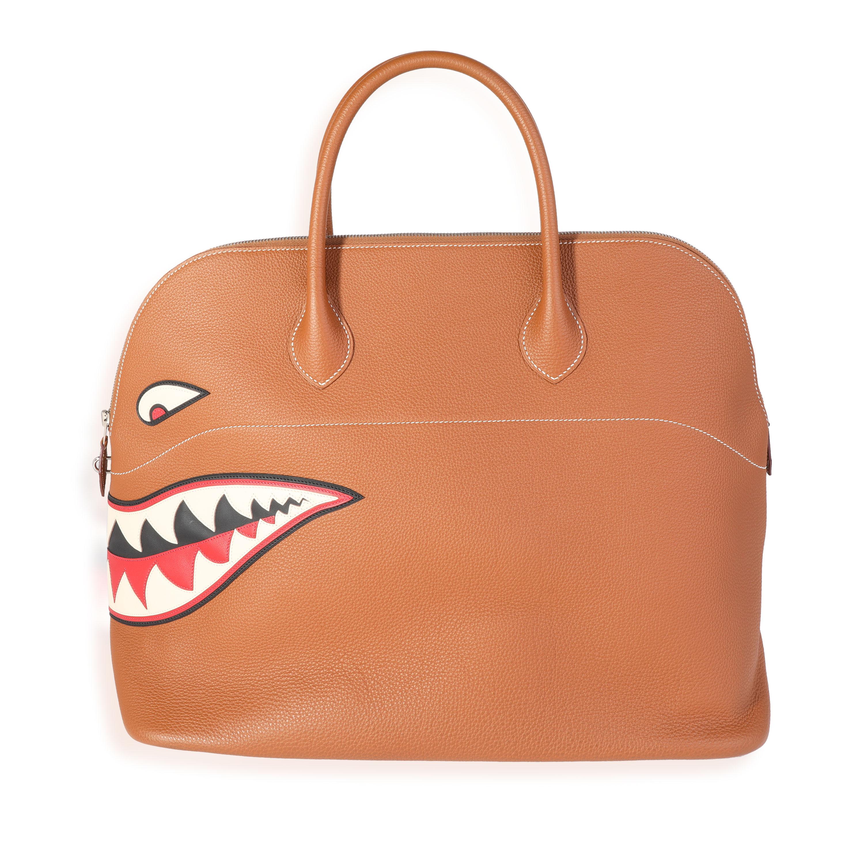 Listing Title: Hermès Gold Togo Shark Bolide 45 PHW
SKU: 121667
Condition: Pre-owned 
Handbag Condition: Excellent
Condition Comments: Excellent Condition. Light scuffing at corners. Scratching at hardware. No other visible signs of wear.
Brand: