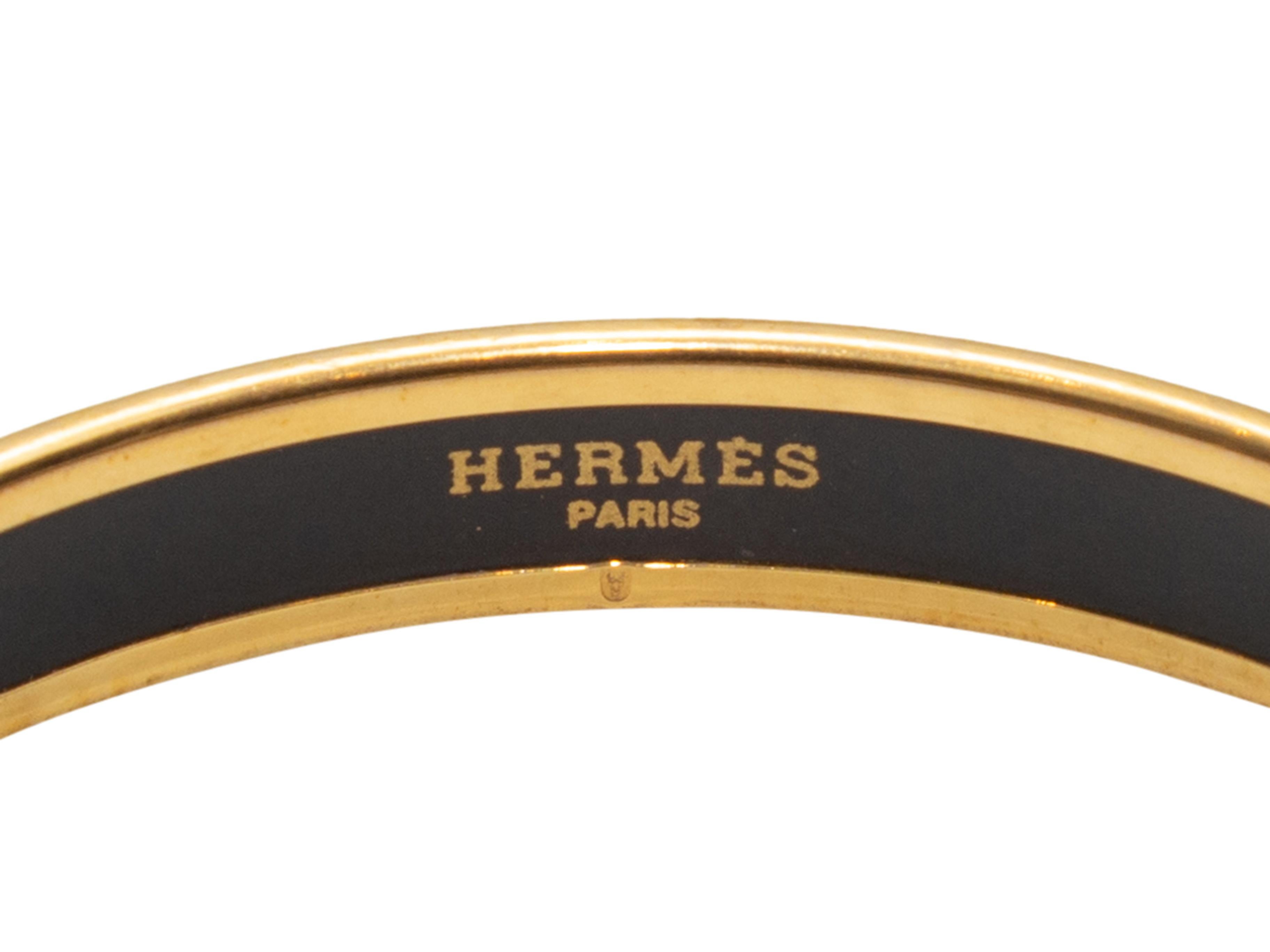 Product details: Gold-tone metal and multicolor enamel rabbit motif bangle bracelet by Hermes. 6