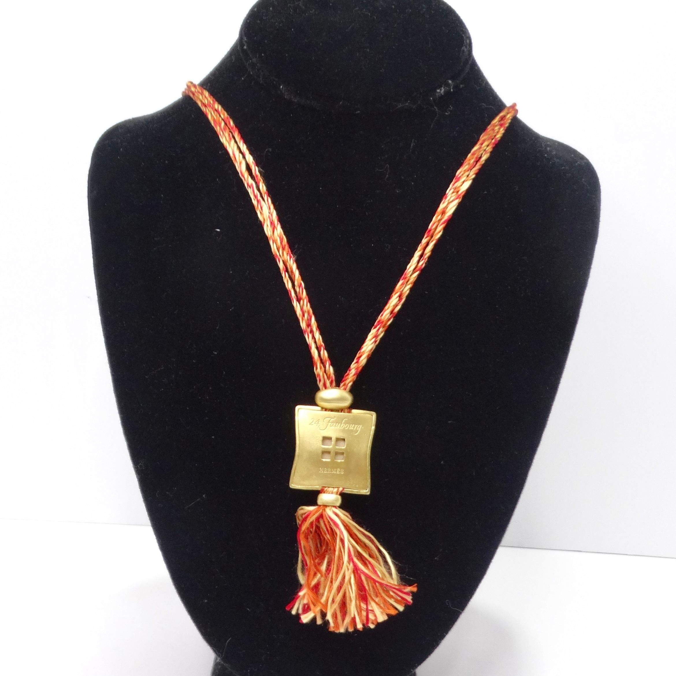 Step into the realm of luxury with the exquisite Hermes necklace, a masterpiece that epitomizes elegance and artistry. This captivating necklace boasts a gold tone square pendant adorned with the iconic Hermes logo on the front and a delicate floral