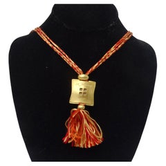 Hermes Gold Tone Pendent on Silk Yarn Chord Necklace