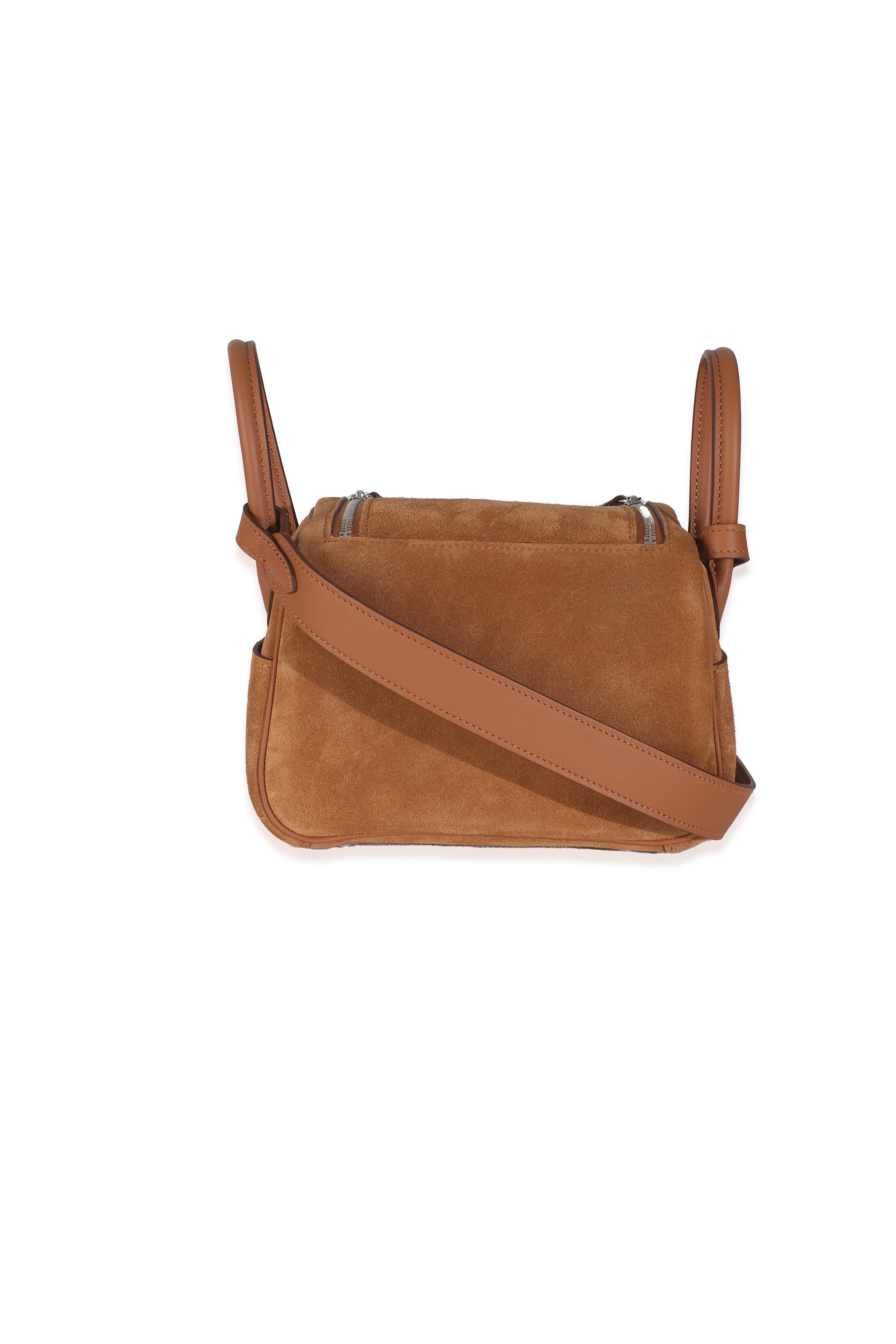 Listing Title: Hermès Gold Veau Grizzly Swift Mini Lindy 20 PHW
SKU: Z146457
Condition: Pre-owned 
Handbag Condition: Pristine
Condition Comments: Item has no indication of wear. Plastic not present along hardware.  Final sale.
Brand: Hermès
Model: