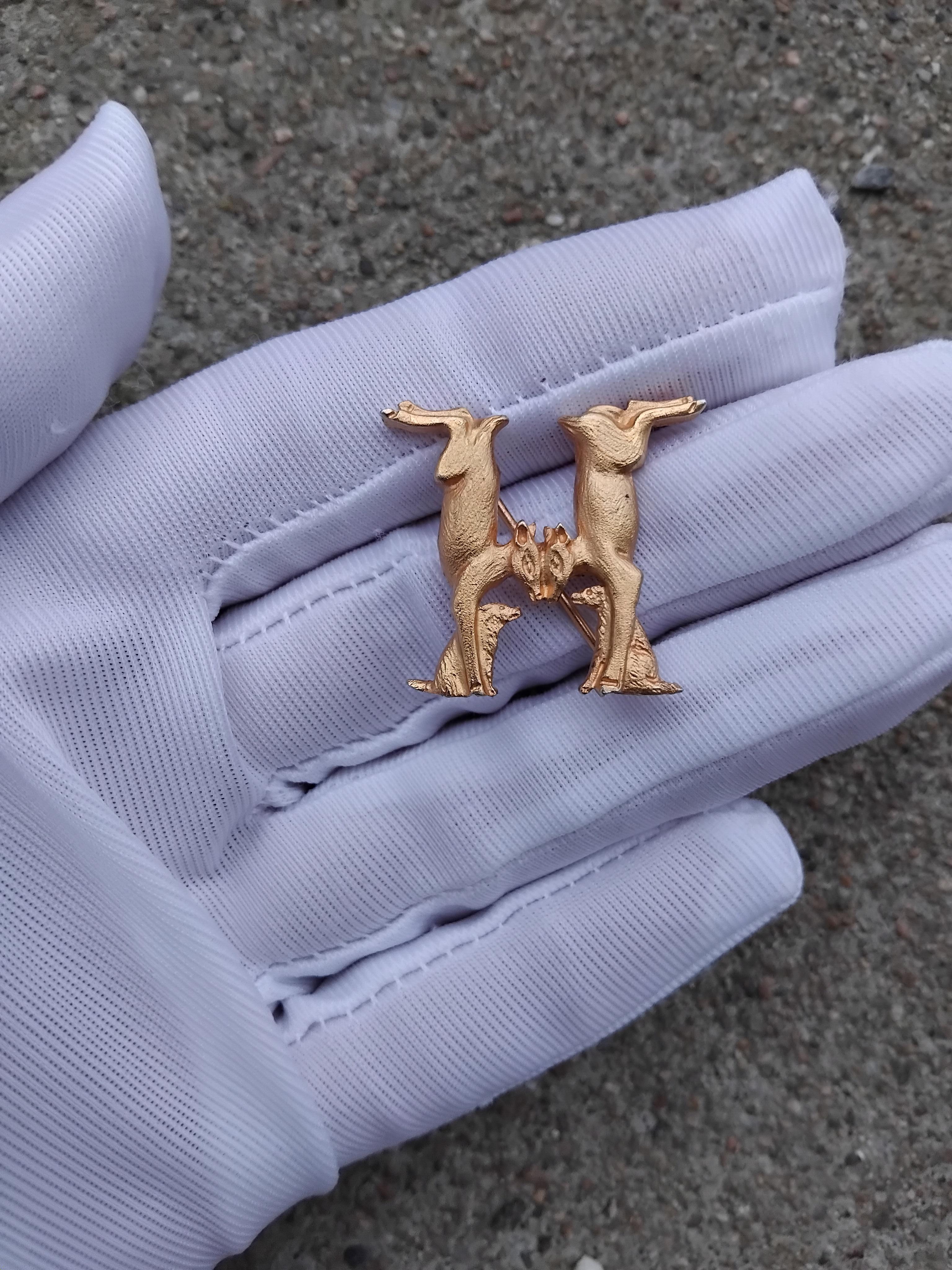 Beautiful Authentic Hermès Brooch

Shape of Does and Dogs Forming an H

We can find this pattern on the Hermès Scarf called 