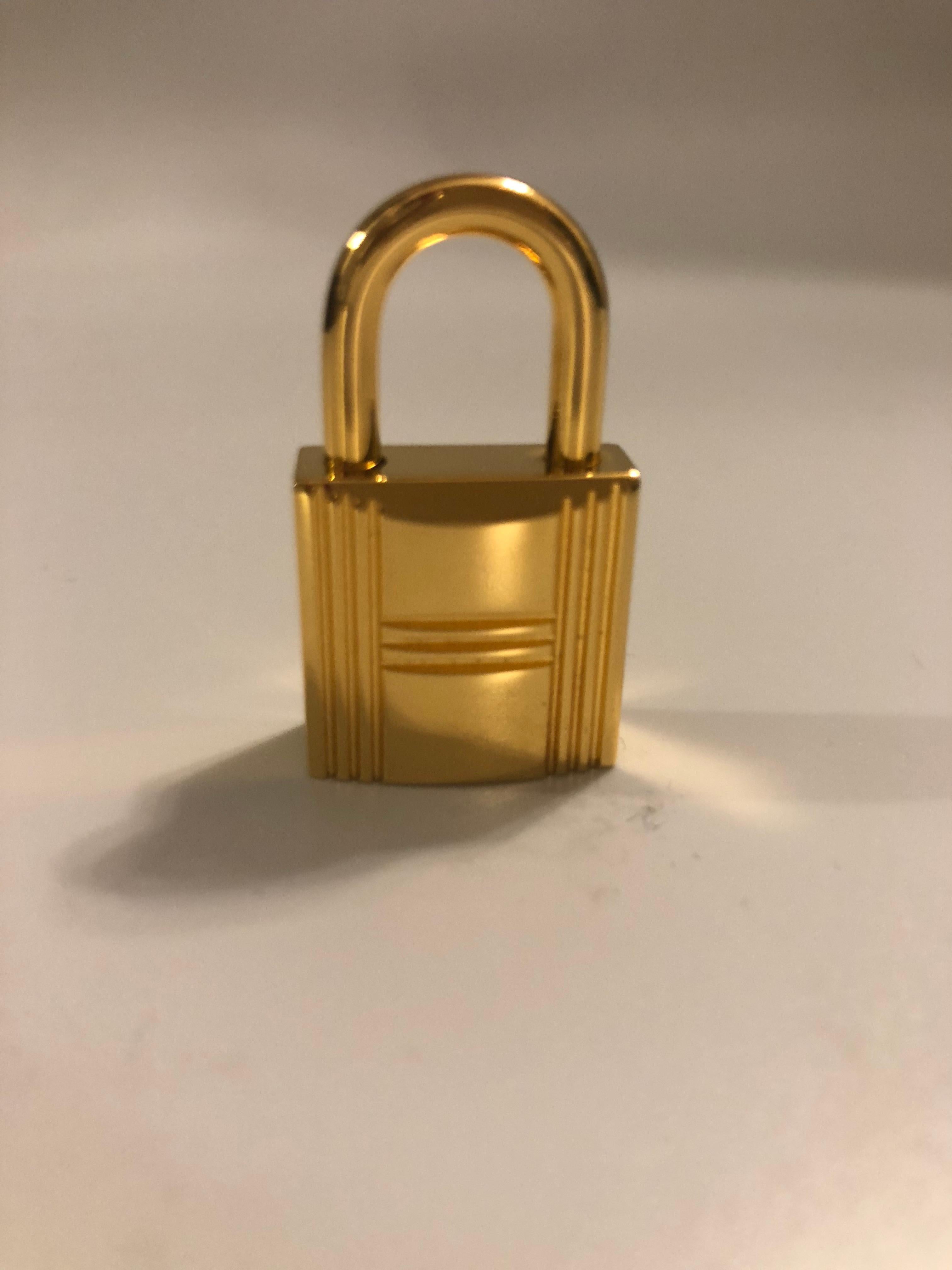 White Hermès Golden Padlock for Birkin or Kelly handbags, brand new !