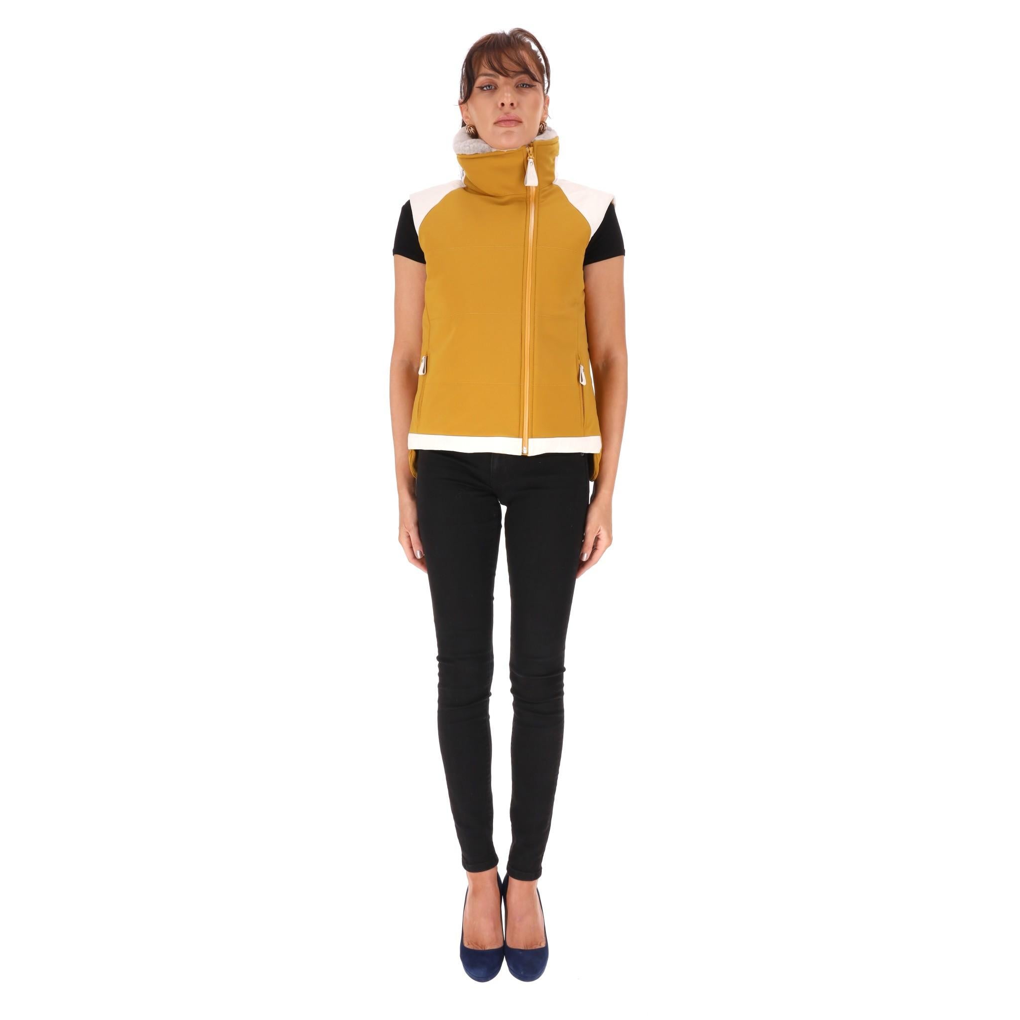 Hermes Goose Down & Mink Fur Gilet

Mustard yellow goose down gilet designed with white leather trim and a light grey mink fur collar.

Featuring branded zipper closure to the side and two zipped pockets.

Rrp Approx. £3,000

Size - 40FR

Condition