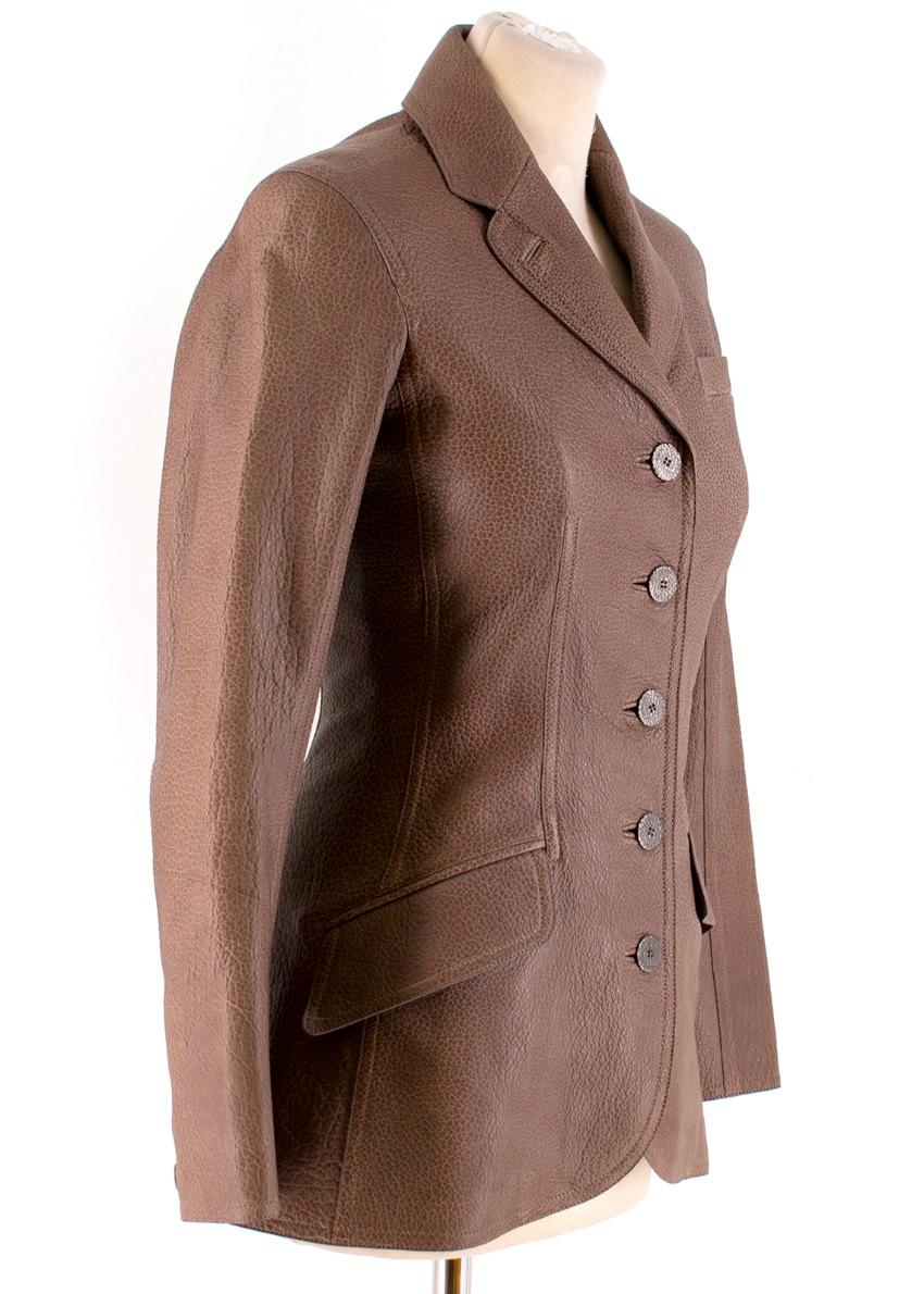 Hermes notch-lapel leather jacket

- Brown, grained bison leather 
- Notch lapel, long sleeves 
- Chest welt pocket, two flap pockets 
- Contouring sleeves 
- Back vent 
- Centre-front button fastening 
- Grey-marl wool lining 

Please note, these