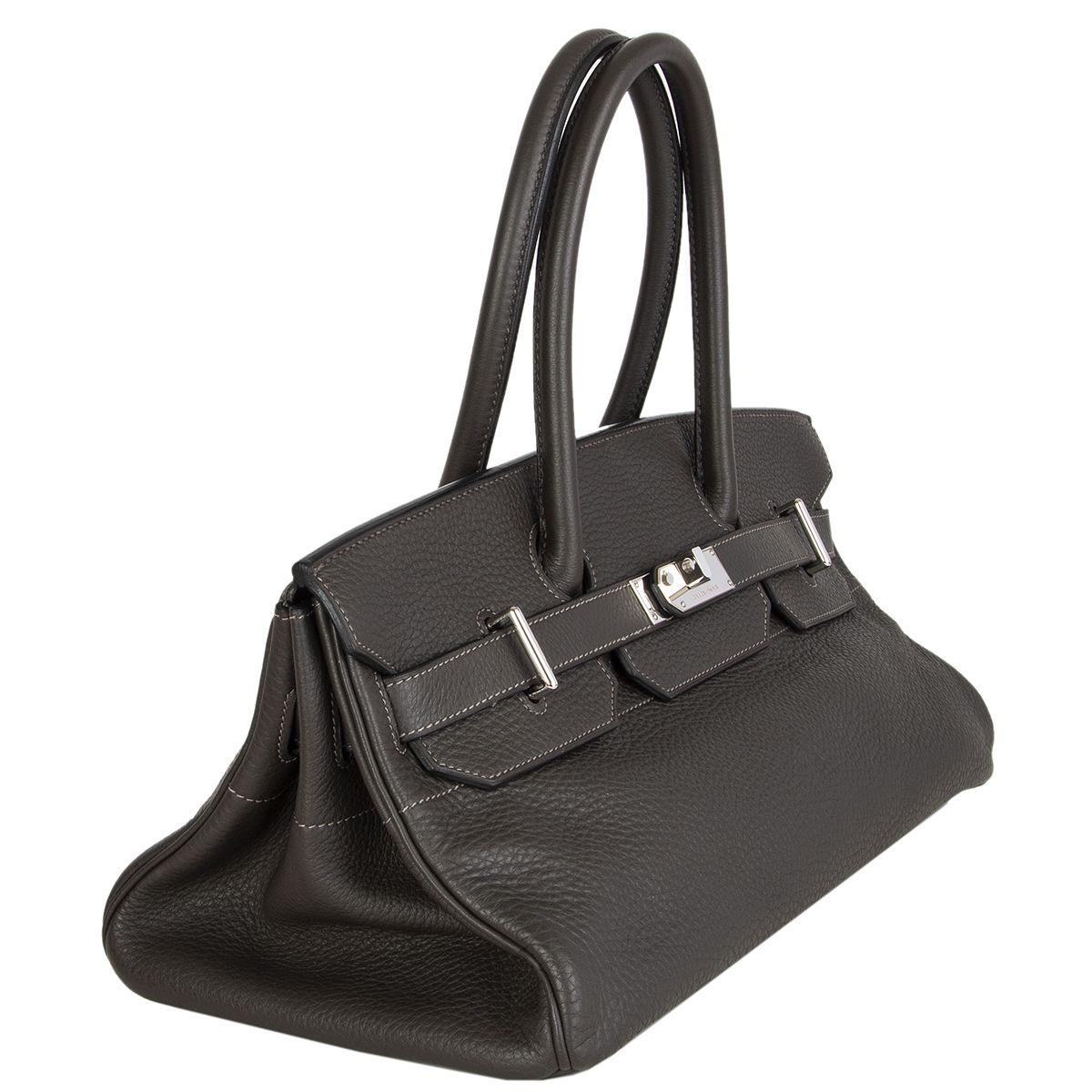 Hermès 'JPG I Shoulder Birkin' bag in Graphite (dark gray) Taurillon Clemence with Palladium hardware. Lined in Chevre (goat skin). Has been carried and is in excellent condition. Comes with lock, key, clochette, dust bag and raincoat. 

Height 19cm