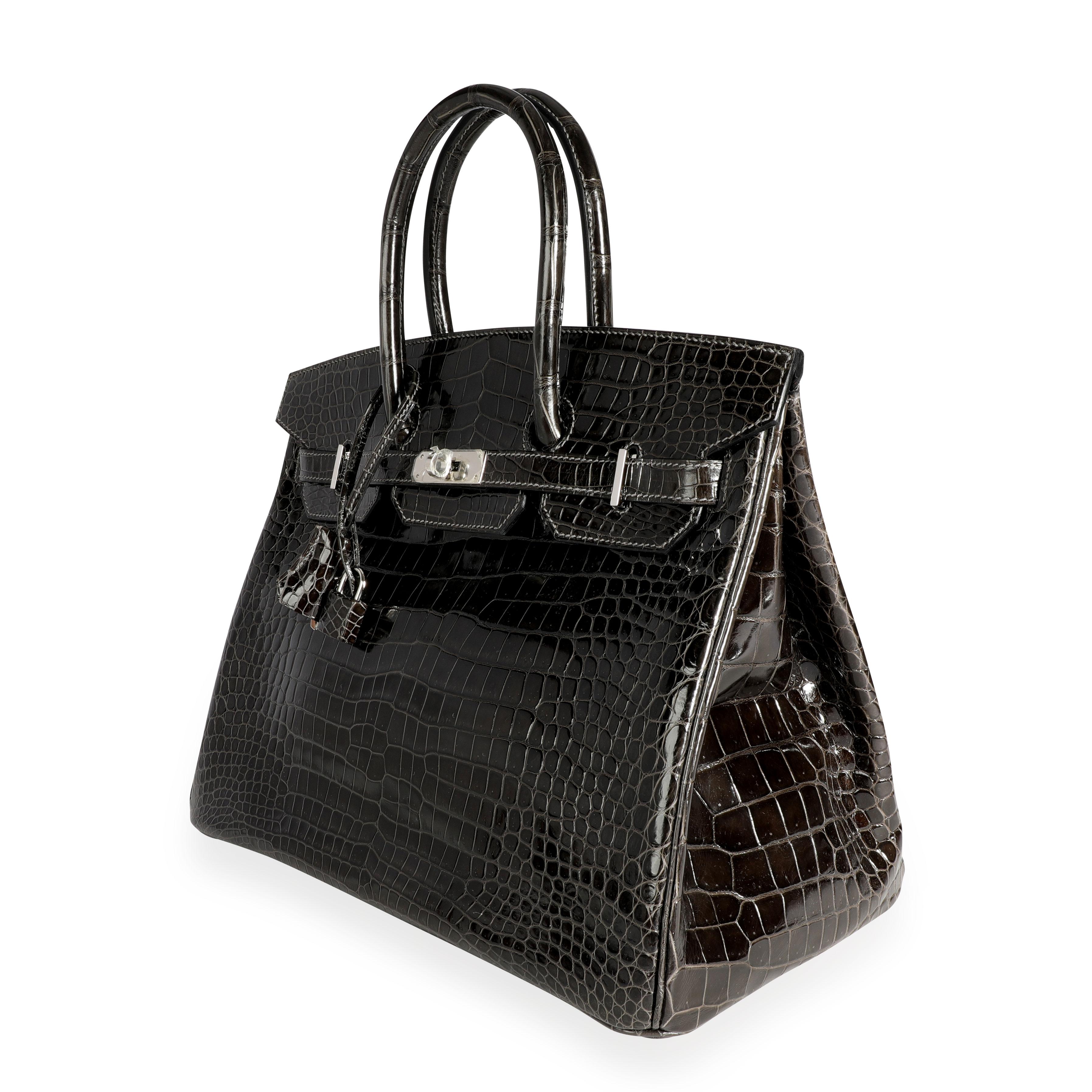 Hermès Graphite Shiny Porosus Crocodile Birkin 35 PHW
SKU: 110345

Handbag Condition: Mint
Condition Comments: Mint Condition. Plastic on most hardware. No visible signs of wear.
Brand: Hermès
Model: Birkin

Origin Country: France
Handbag