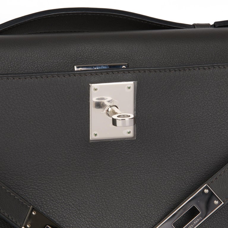 HERMÈS Graphite Swift Leather Kelly Cut at 1stDibs hermes clutch kelly