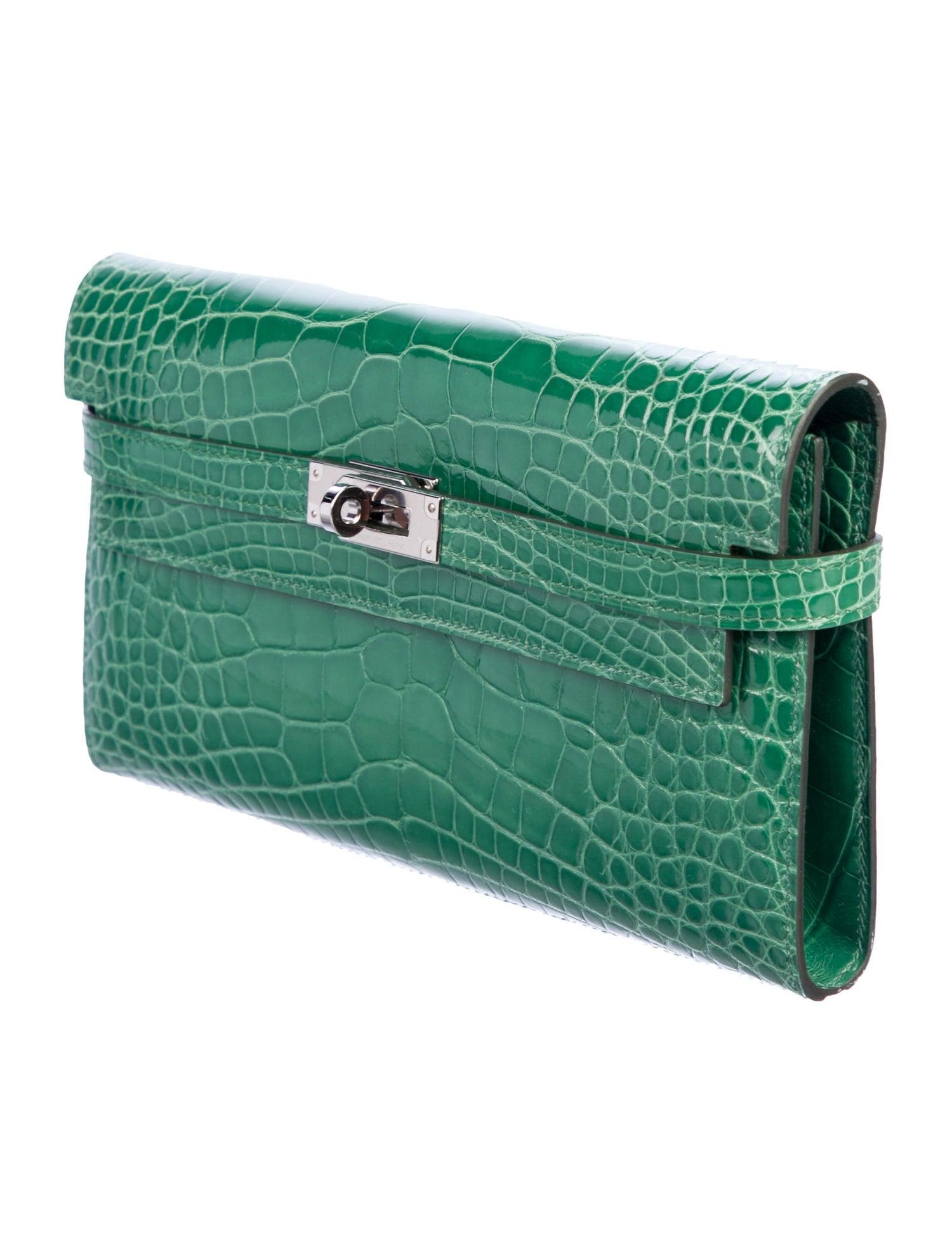 Hermes Green Alligator Exotic Palladium Silver Evening Kelly Clutch Wallet Bag in Box

Alligator 
Palladium tone hardware
Turnlock closure
Leather lining
Date code present
Made in France
Features zip closure, bill compartment and 12 card slots