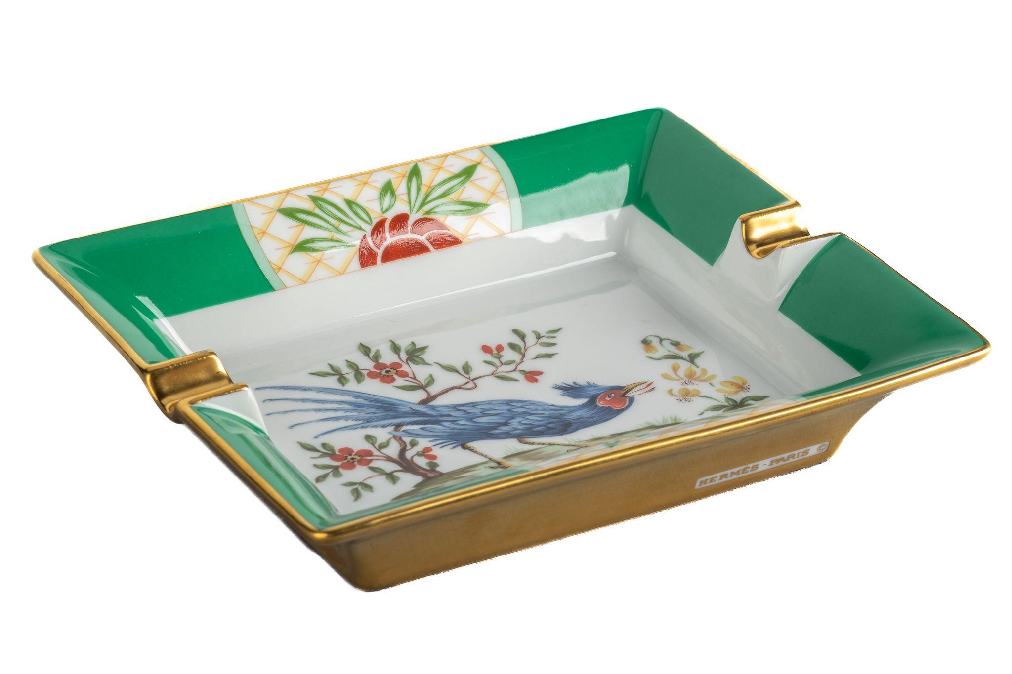 Hermes signature ashtray with green bird design in green  and gold. Suede stamped bottom. Minor wear on it. Made in France.