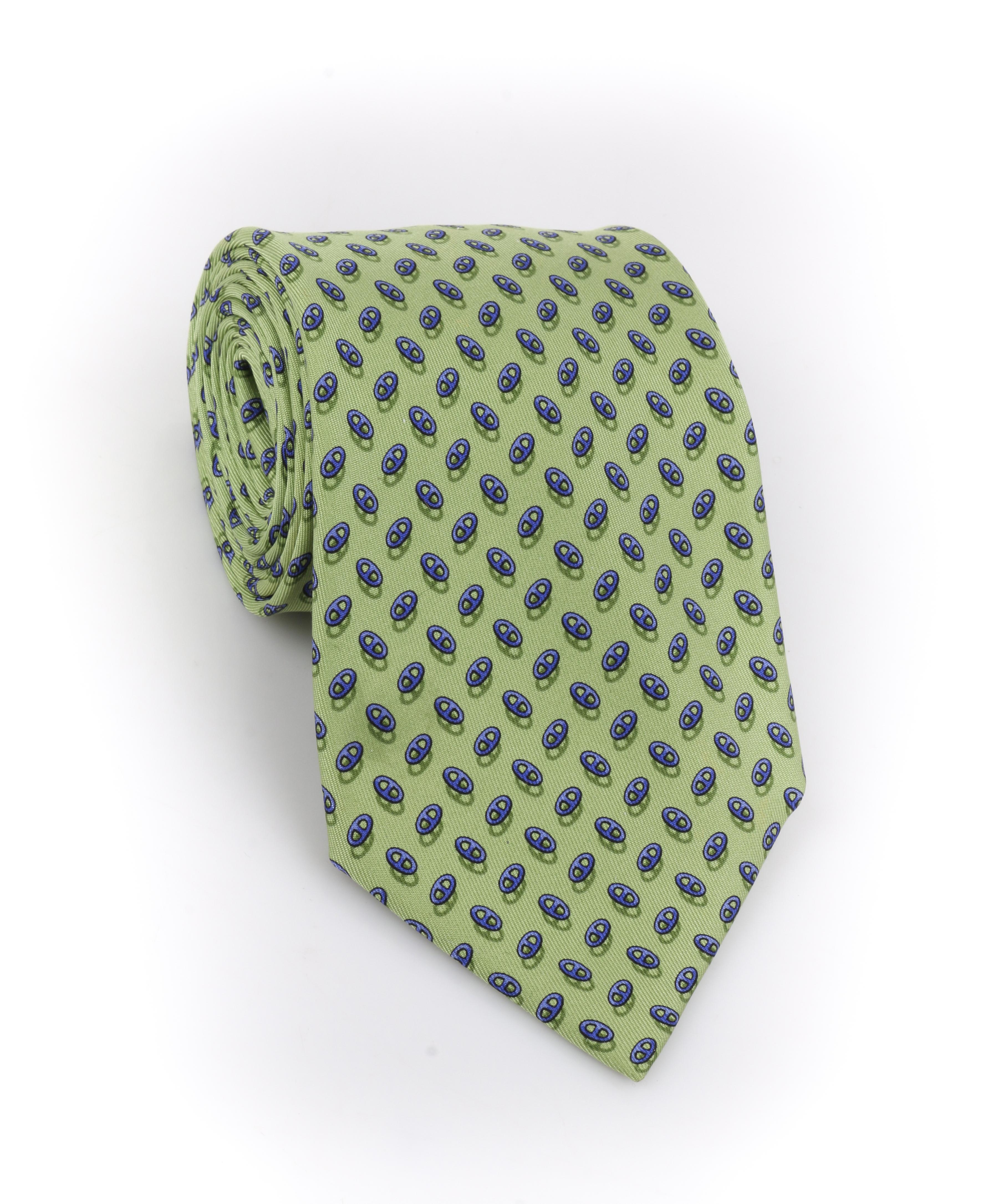 HERMES Green Blue Chaine D'ancre Pattern 5 Fold Silk Necktie Tie 7957 EA
 
Brand / Manufacturer: Hermes
Style: 5 fold necktie 
Color(s): Shades of green & blue
Lined: Yes
Marked Fabric Content: 100% Silk
Additional Details / Inclusions: All over