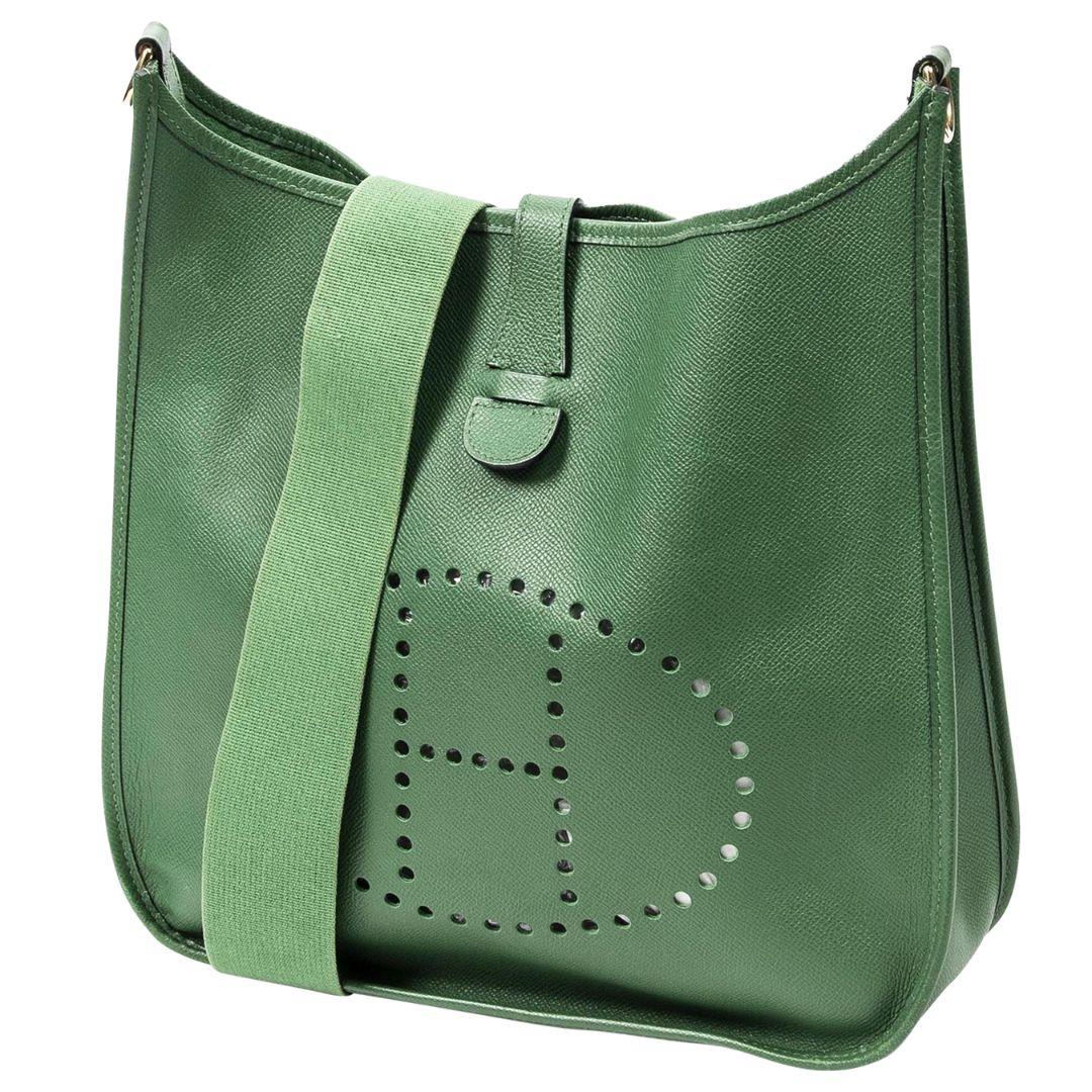 The most gorgeous shade of green! The Evelyne silhouette is influenced by an equestrian groom’s tool bag. Crafted in a green Courchevel leather with gold hardware, and a perforated H within an oval for ventilation. The leather is very lightweight,