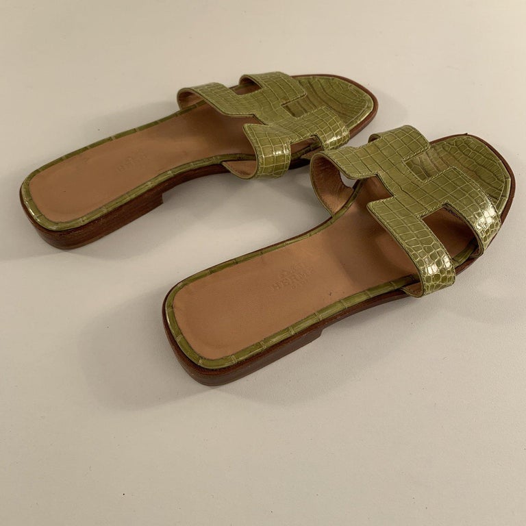 Hermes Green Leather Oran Flat Slide Sandals Slip On Shoes Size 36 For Sale  at 1stDibs | hermes oran green, hermes oran green sandals, green oran