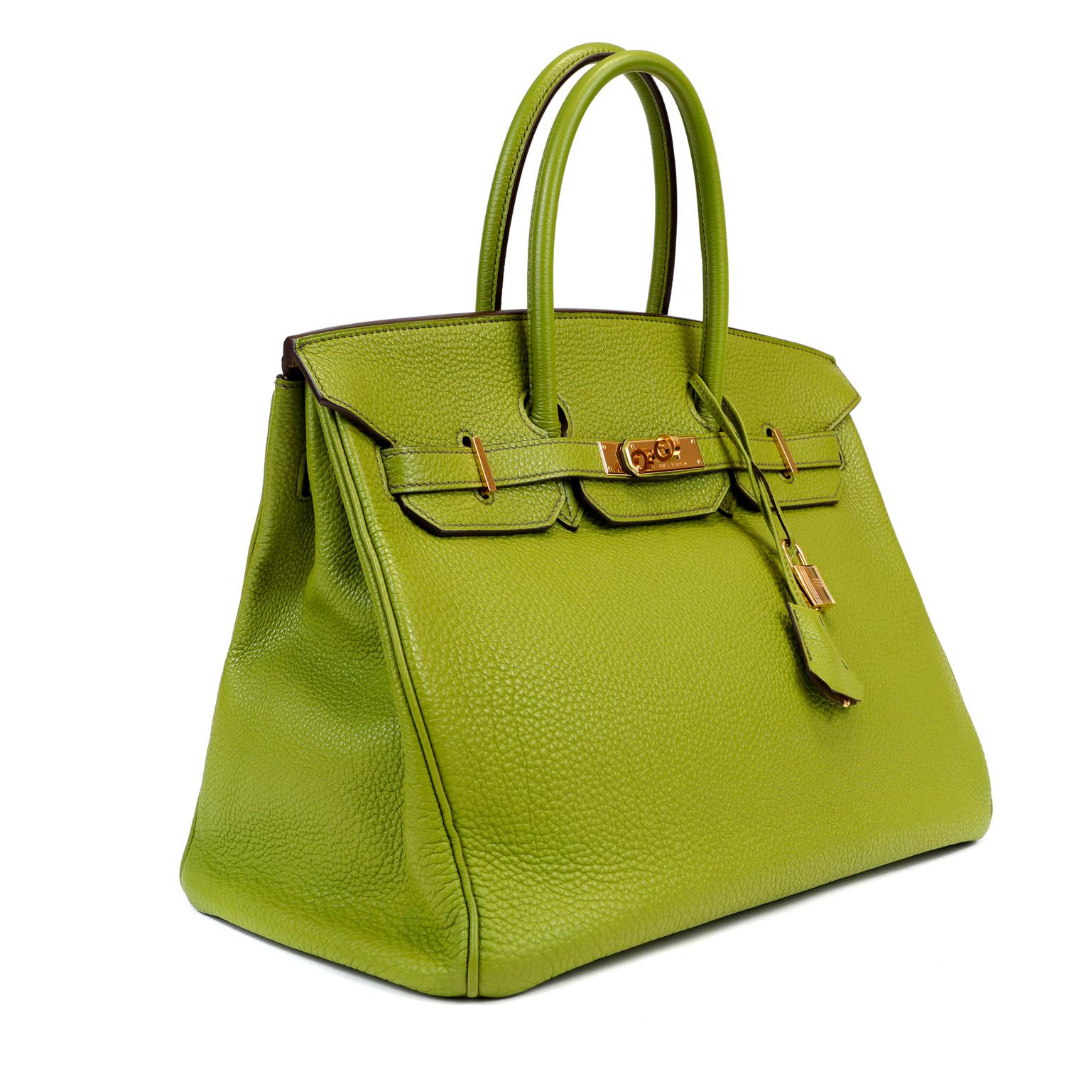 This authentic Hermès Green Togo 35 cm Birkin is in excellent condition. Hand stitched by skilled craftsmen, wait lists of a year or more are common for the Hermès Birkin. Glorious Granny apple green paired with gold hardware is a brilliant pop of