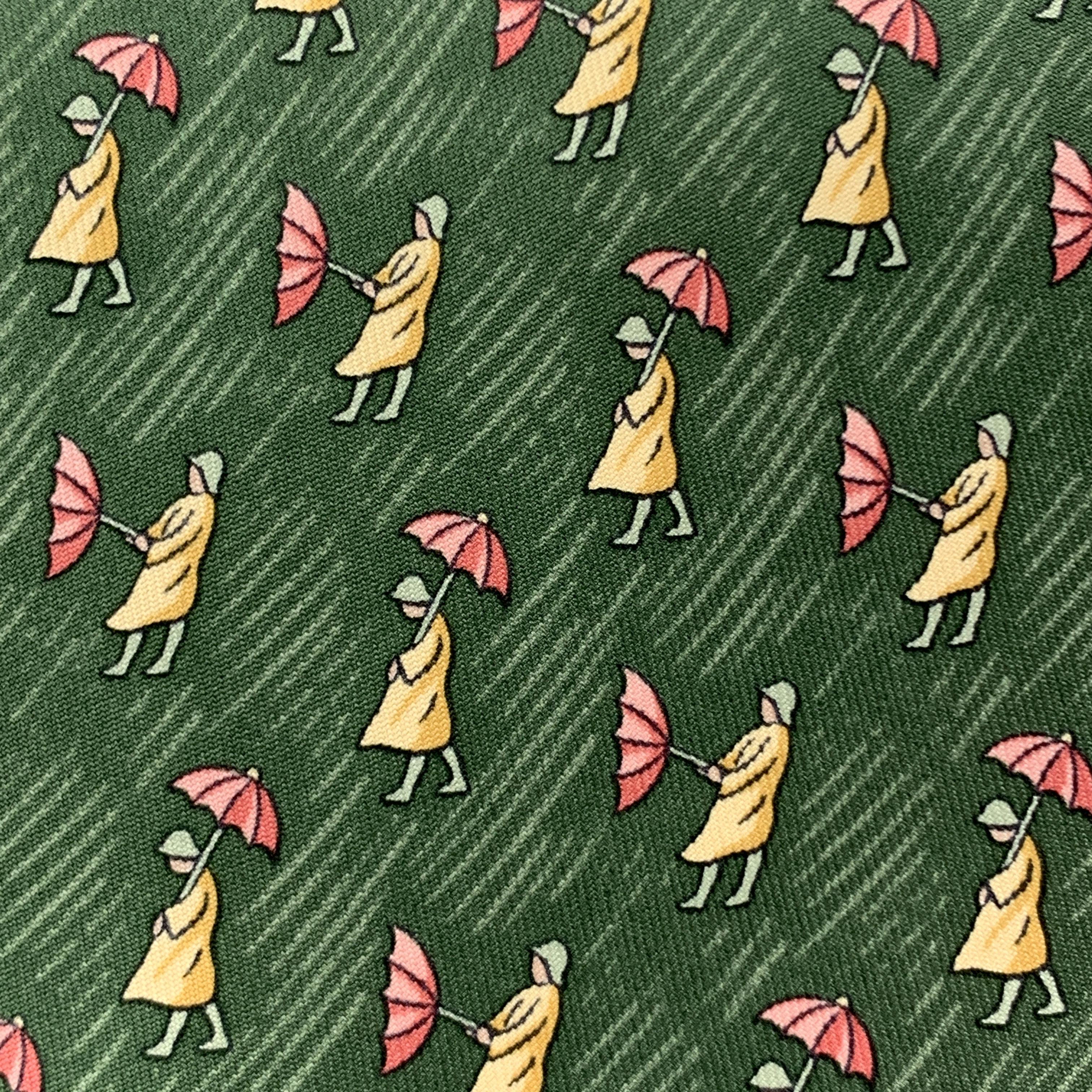 HERMES necktie comes in green silk twill with all over man in the rain with umbrella print. Made in France.

Excellent Pre-Owned Condition.

Width: 3.5 in.  