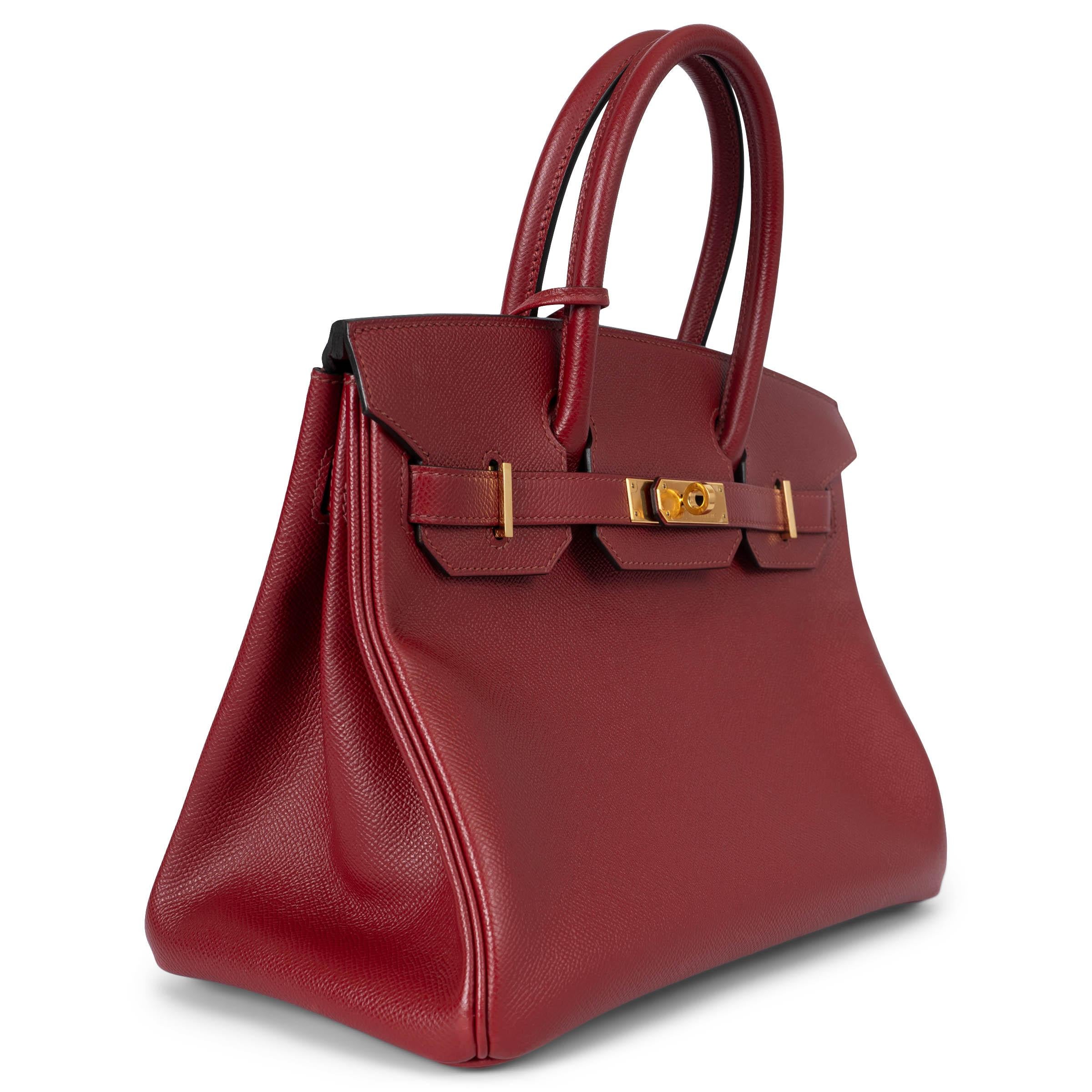 100% authentic Hermès 'Birkin 30' bag in Rouge Grenat (dark red) Veau Epsom leather with palladium hardware. Lined in Chevre (goat skin) with an open pocket against the front and a zipper pocket against the back. Has been carried and is in excellent