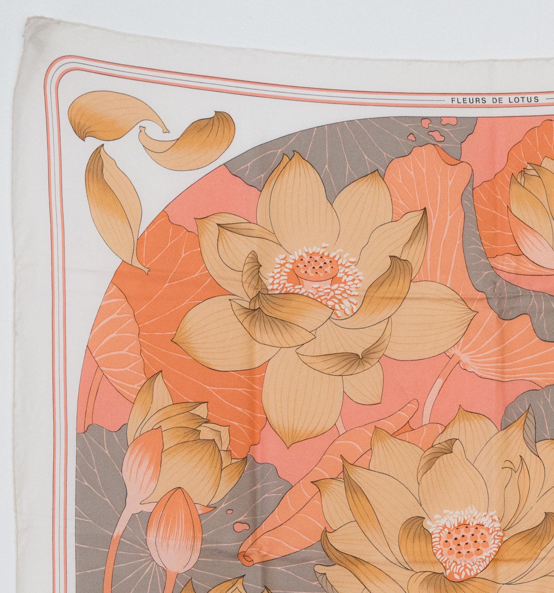 Hermes silk scarf Fleurs de Lotus by Christiane Vauzelle featuring a beige, pink & grey lotus floral scene.
Circa 1976s 
In excellent vintage condition. Made in France.
35,4in. (90cm)  X 35,4in. (90cm)
We guarantee you will receive this  iconic item
