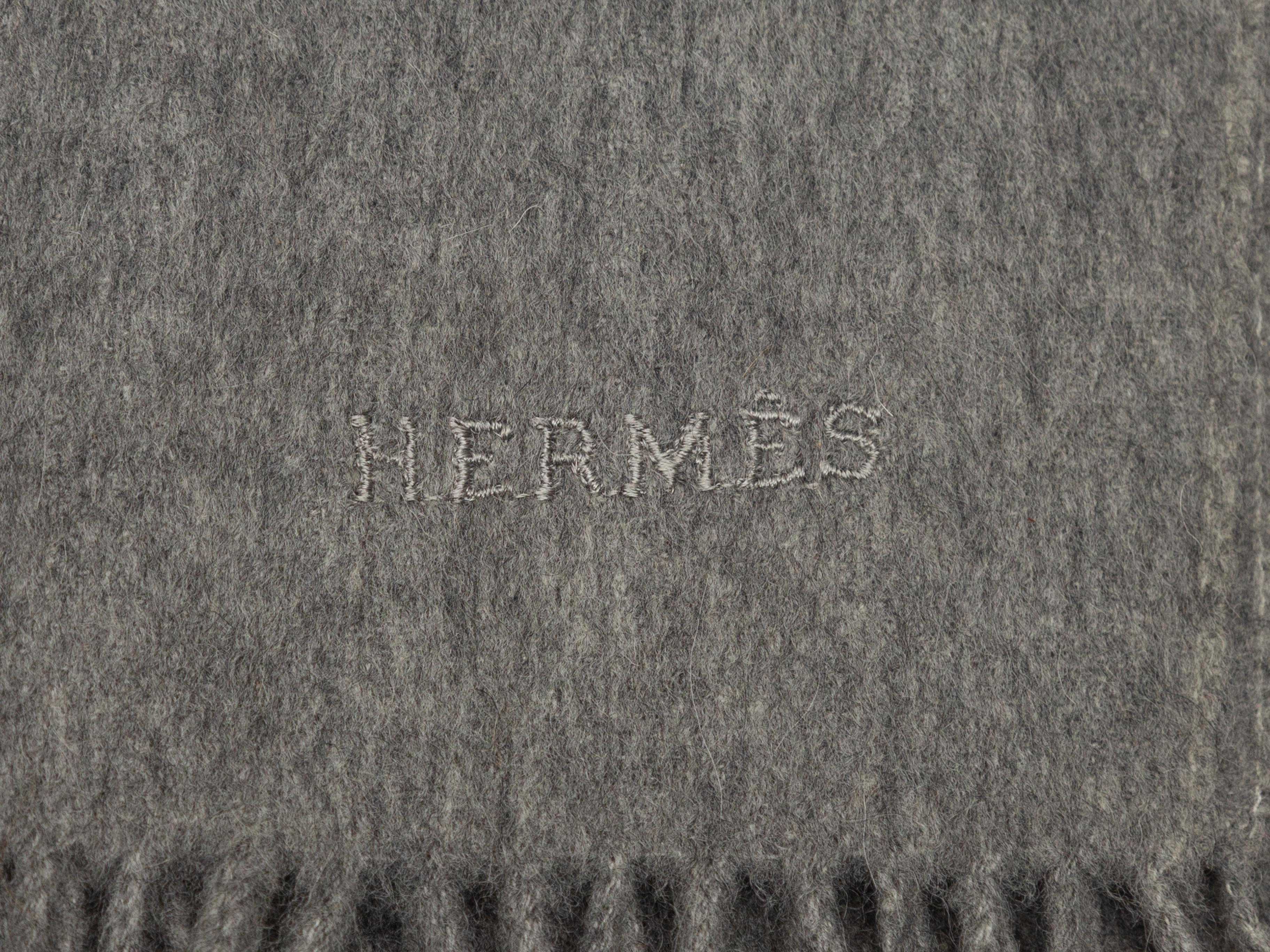 Product Details: Grey cashmere scarf by Hermes. Fringe trim at ends. 73