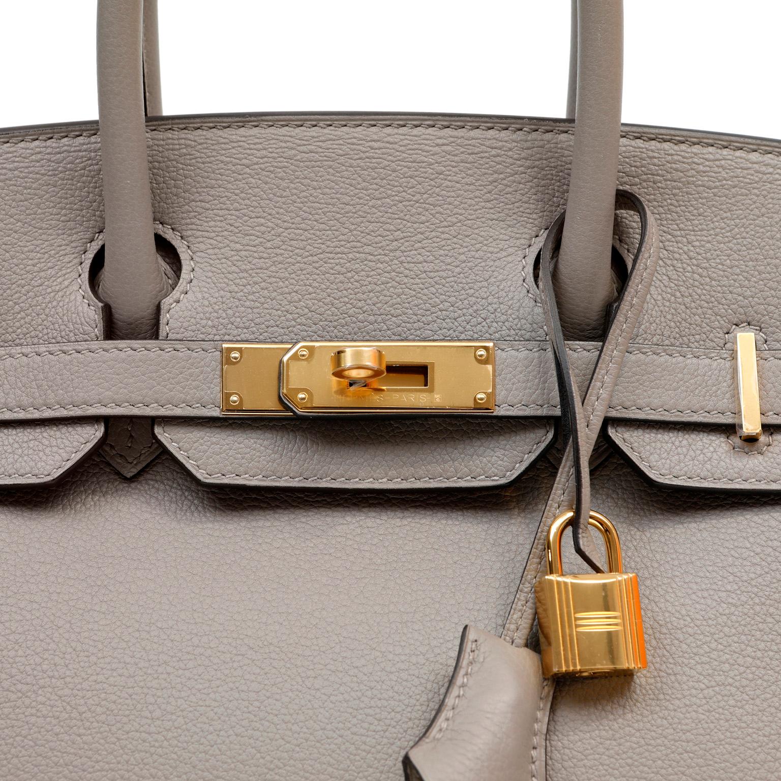 This authentic Hermès Grey Chevre Leather 30 cm Birkin Bag is in pristine unworn condition.  Hand stitched by skilled craftsmen; the Birkin is the epitome of luxury worldwide.  Chevre leather is extremely desirable in the Birkin and rarely found.