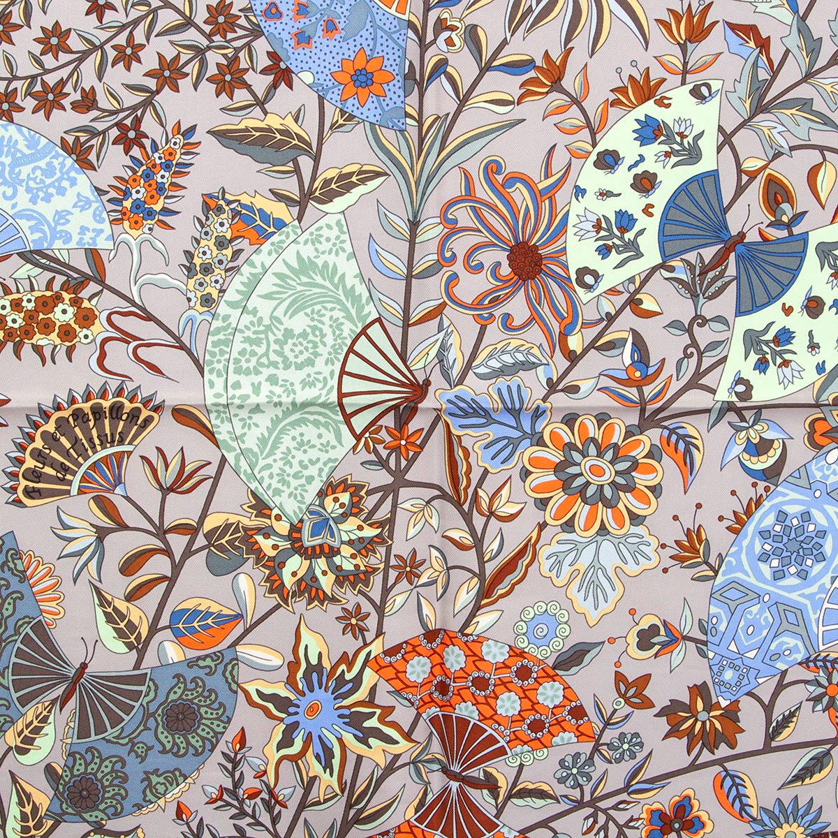 100% authentic Hermès Fleurs Et Papillons de Tissus 90 by Christine Henry in gray silk twill (100%) with contrasting orange hem and details in orange, brown, lilac, mint, blue and burgundy. Has been worn is in excellent