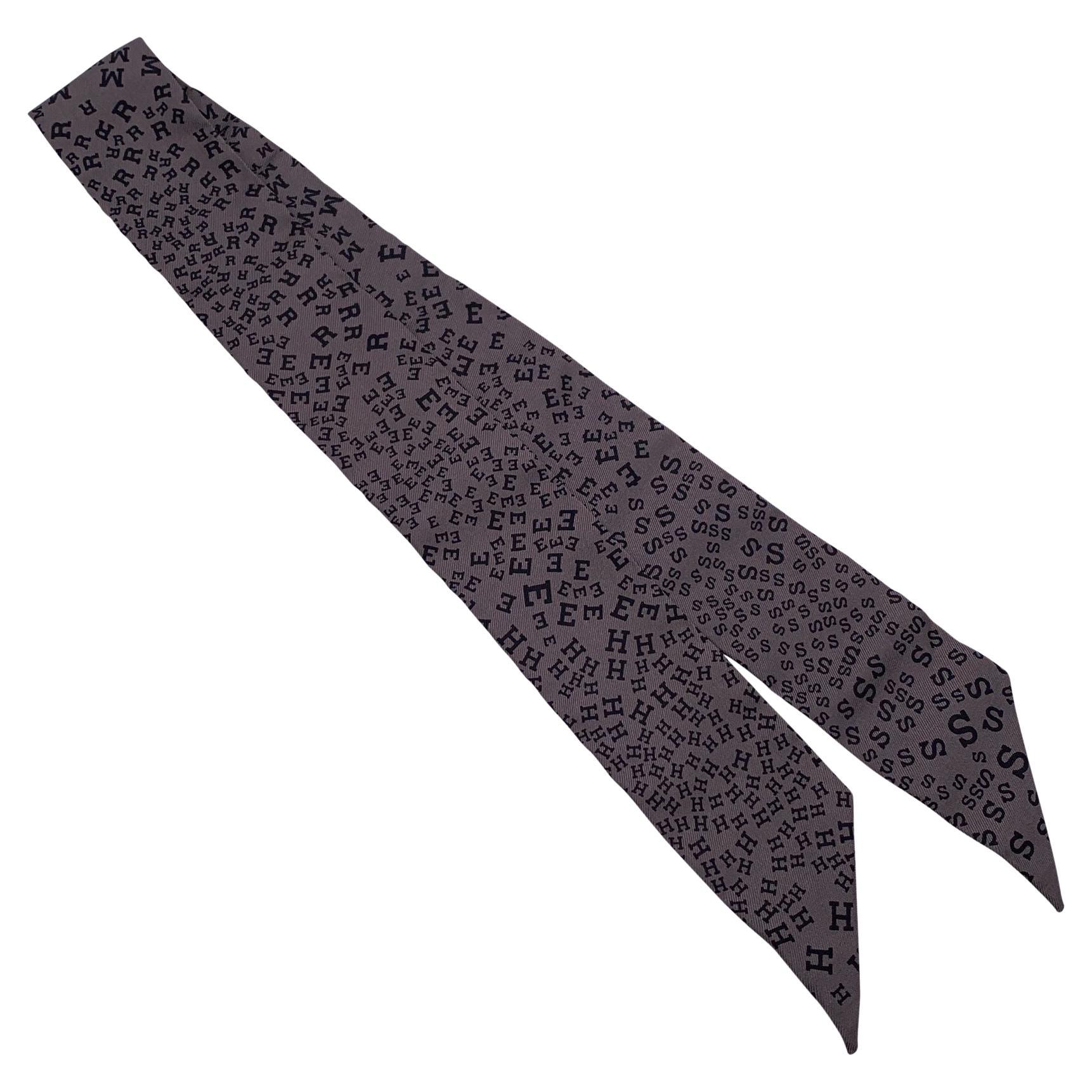 Hermes Grey Silk Brand Scattered Letters Twilly Ribbon Scarf with Box im Angebot