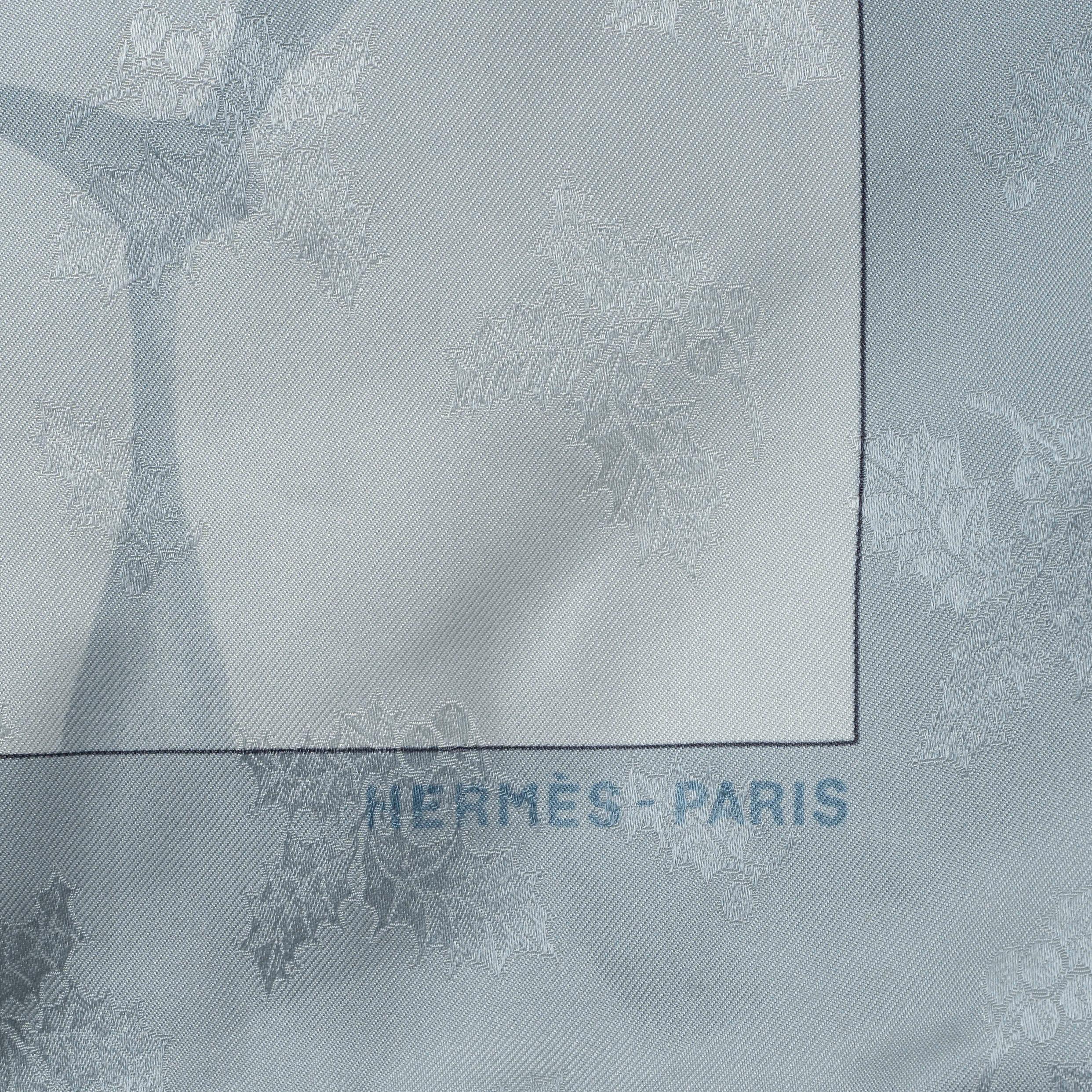 This 100% authentic Hermès Neige d’Antan Detail 90 scarf, designed by Cathy Latham, is crafted from silver grey silk twill (100%) and features a delicate Holly print in shades of blue, sage green, orange, and beige. A beautifully detailed design, it