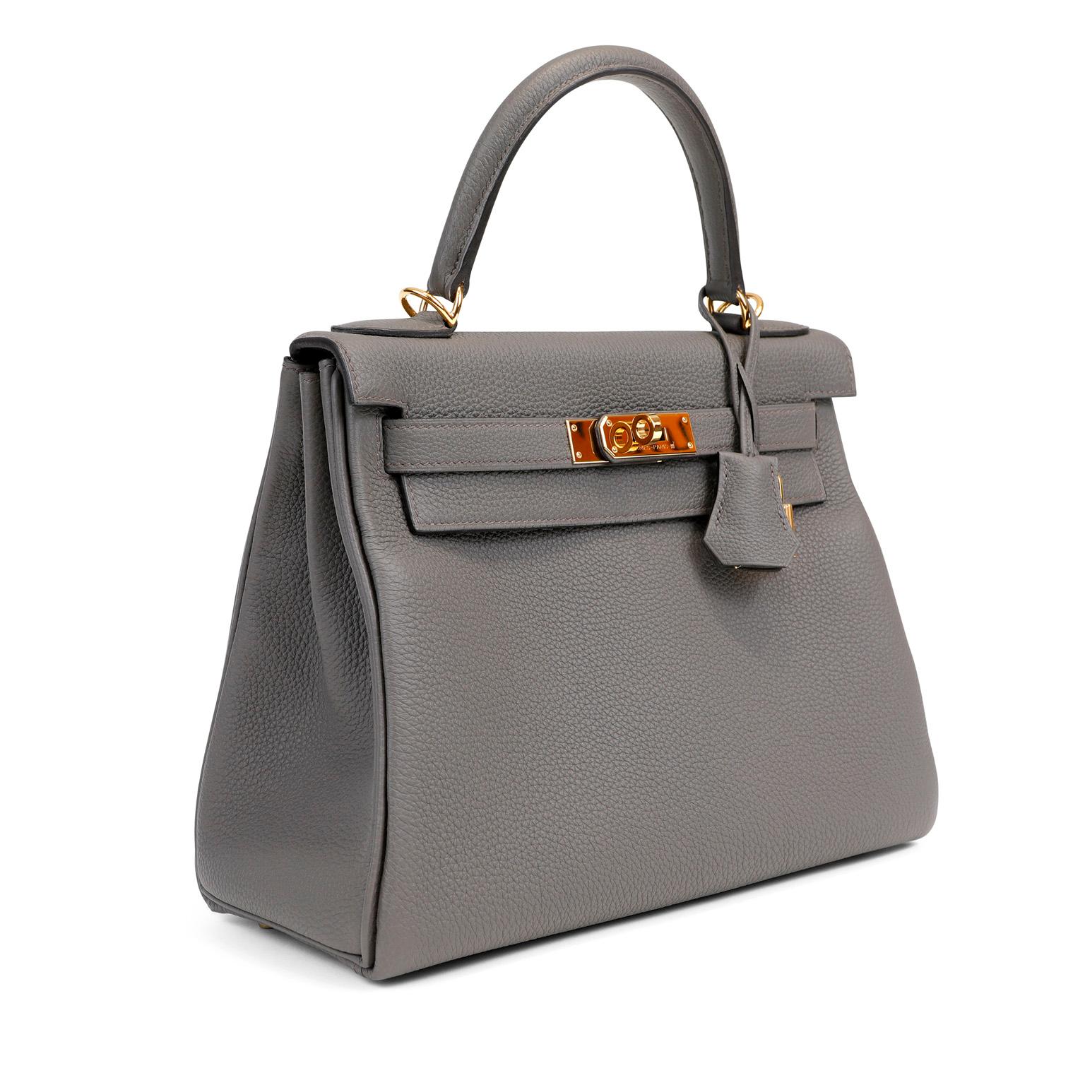This authentic Hermès Grey Togo Leather 28 cm Kelly in pristine condition.    Hermès bags are considered the ultimate luxury item worldwide.  Each piece is handcrafted with waitlists that can exceed a year or more.  The streamlined and demure Kelly