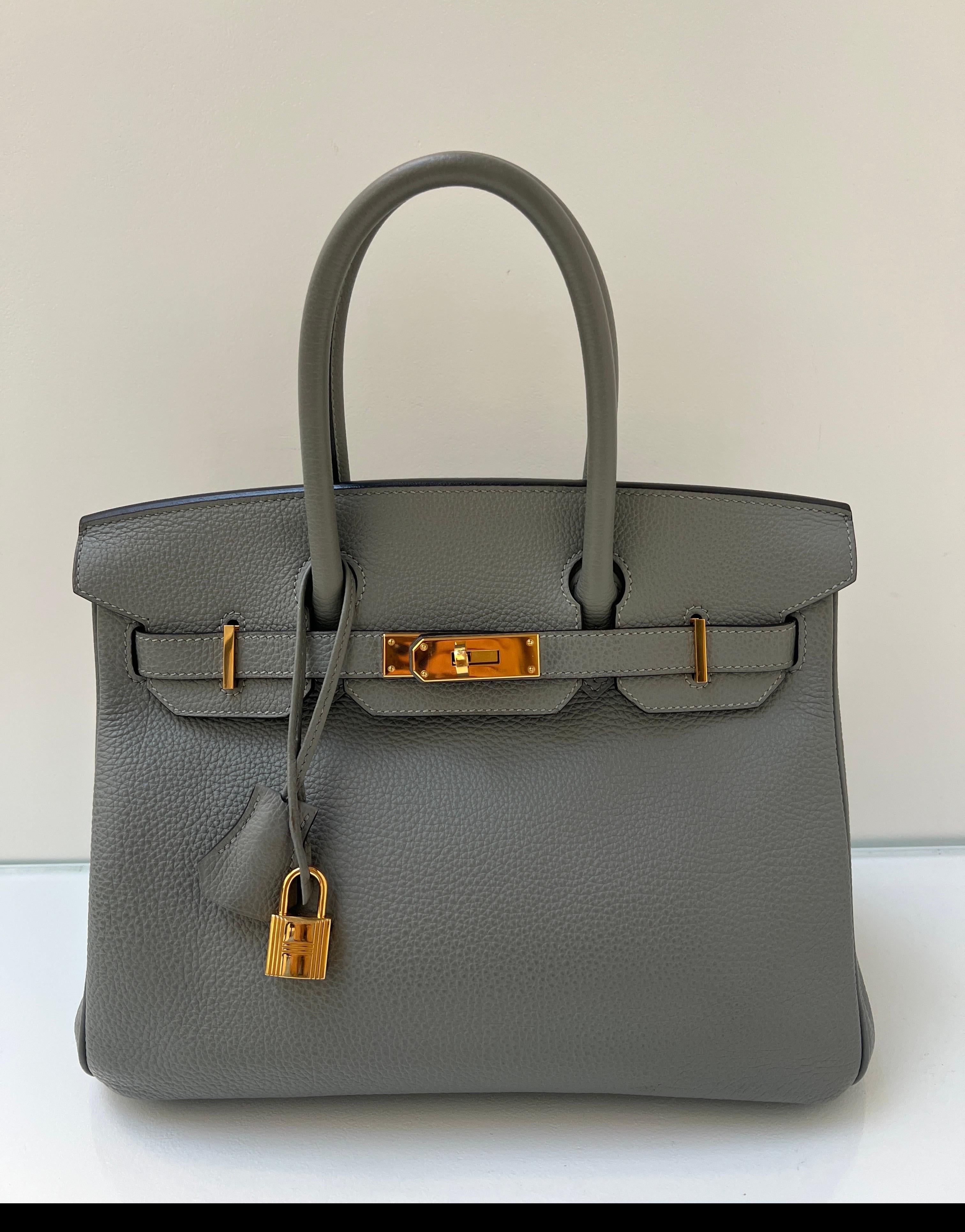 Hermes Gris Birkin 30 Bag. Excellent condition. Newer bag looks like new. Togo leather. Interior clean. Gold hardware. Most wanted size and nuetral color. Includes clochette, lock, keys, and dust bag. Guaranteed authentic. 