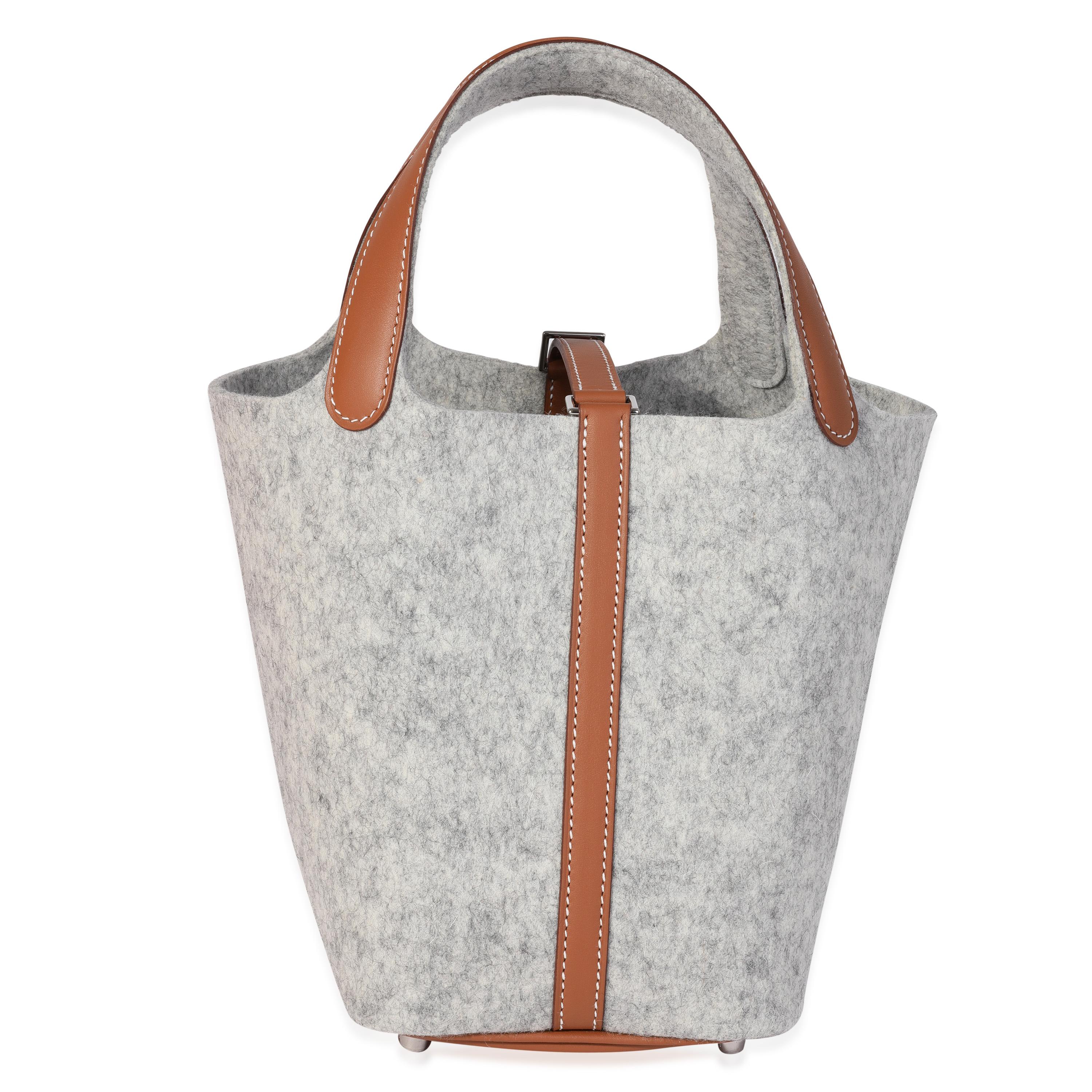 Listing Title: Hermès Gris Clair Feutre & Gold Swift Picotin Lock 18 PHW
SKU: 120407
Condition: Pre-owned 
Handbag Condition: Mint
Condition Comments: Mint Condition. Final sale.
Brand: Hermès
Model: Picotin Lock
Origin Country: France
Handbag