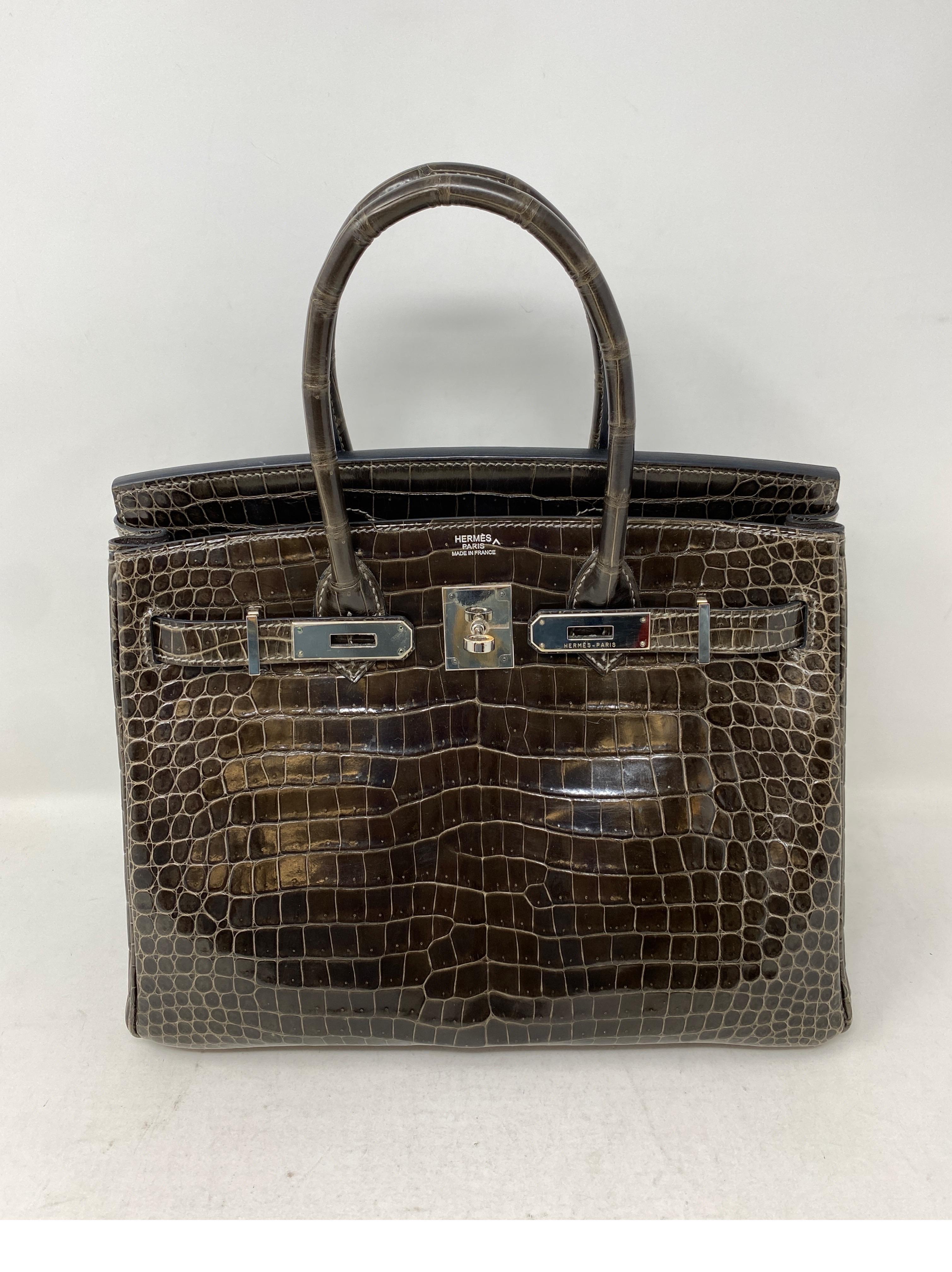 Hermes Gris Fonce Crocodile Birkin 30 Bag. Stunning dark grey exotic with palladium hardware. Good condition. Rare size. Beautiful rich color. Includes clochette, lock, keys, and dust cover. Guaranteed authentic. 