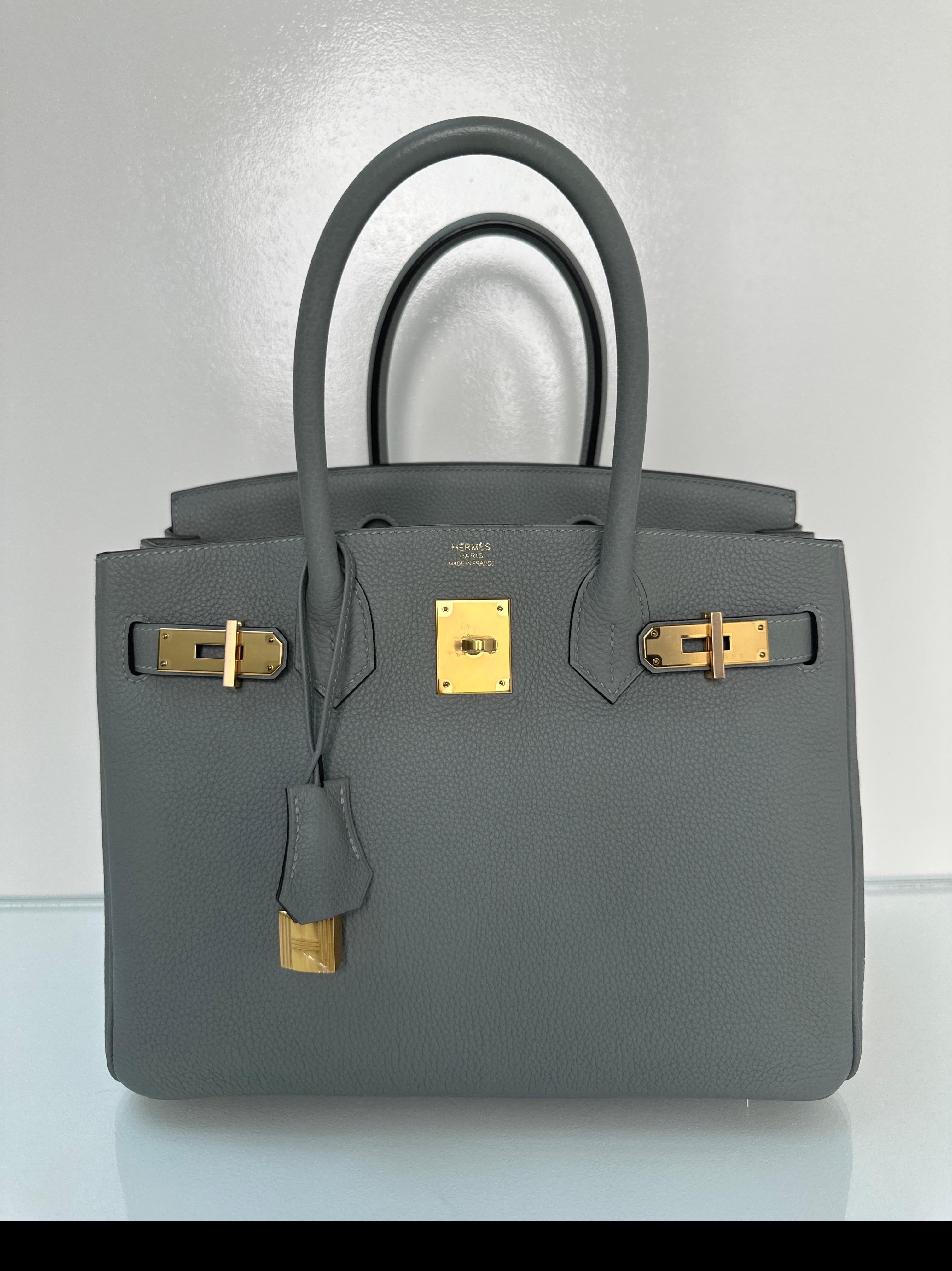 Hermes Gris Mouette Birkin 30 Bag. Togo leather. Gold hardware. Excellent condition. Looks like new. Interior clean. Plastic is still on hardware. Includes clochette, lock, keys, and dust bag. Guaranteed authentic. 