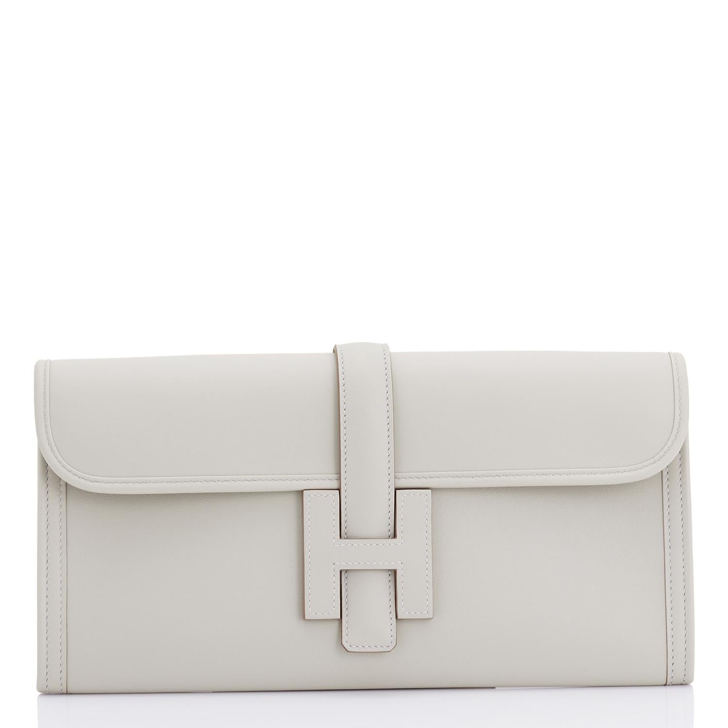 Hermes Gris Perle Light Pearl Grey Jige Elan Clutch 29cm Elegant
Perfect Gift!  Brand New in Box.  Store Fresh in Pristine condition.  
Comes in full set with Hermes dust bag, Hermes ribbon, and Hermes box.
Gris Perle or Pearl Grey is one of the