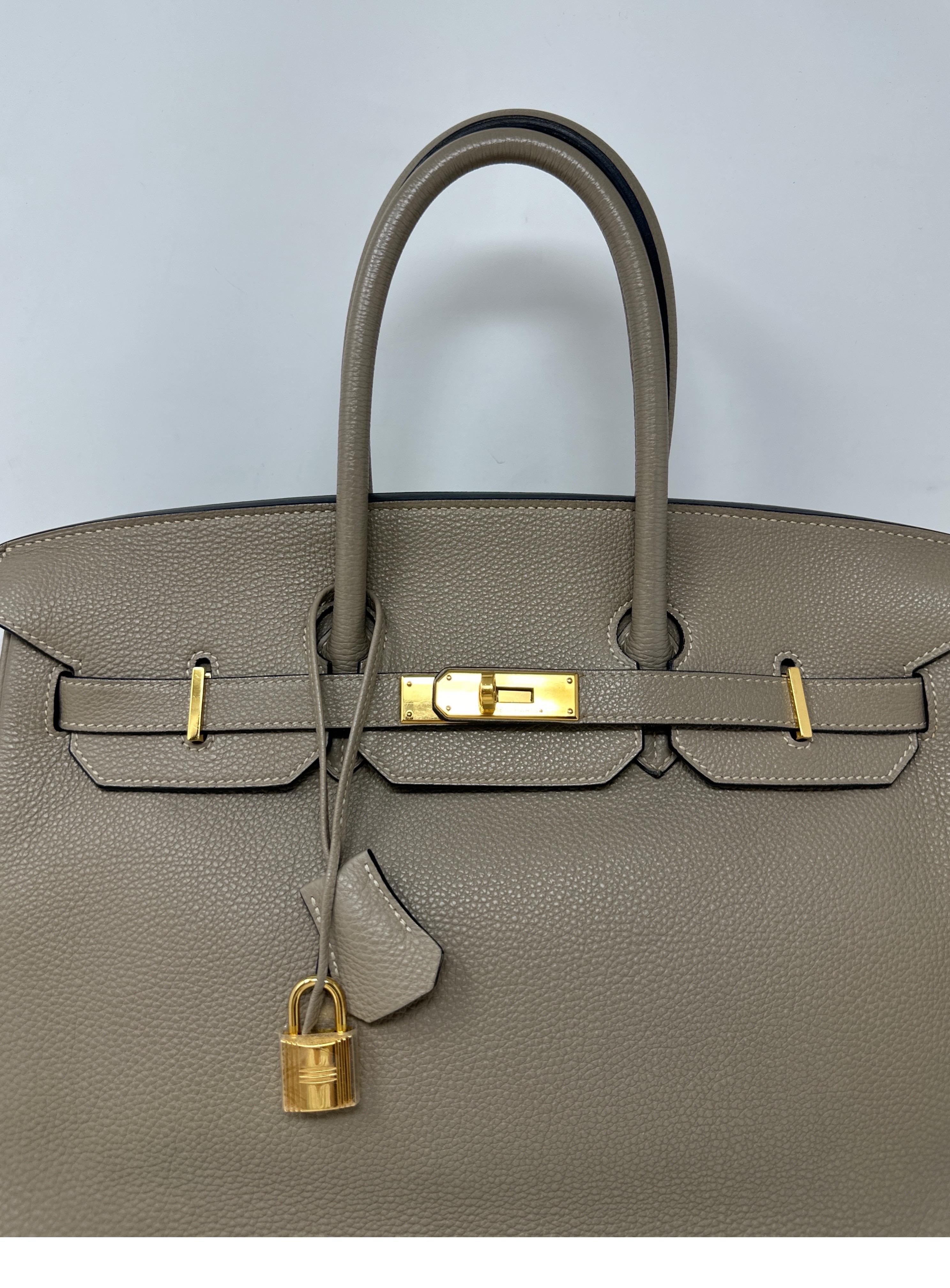 Hermes Gris Tourterelle Birkin 35 Bag. Gold hardware. Rare combination. Harder to find with gold. Interior clean. Includes clochette, lock, keys, and dust bag. Guaranteed authentic. Don't miss out on this investment bag. 