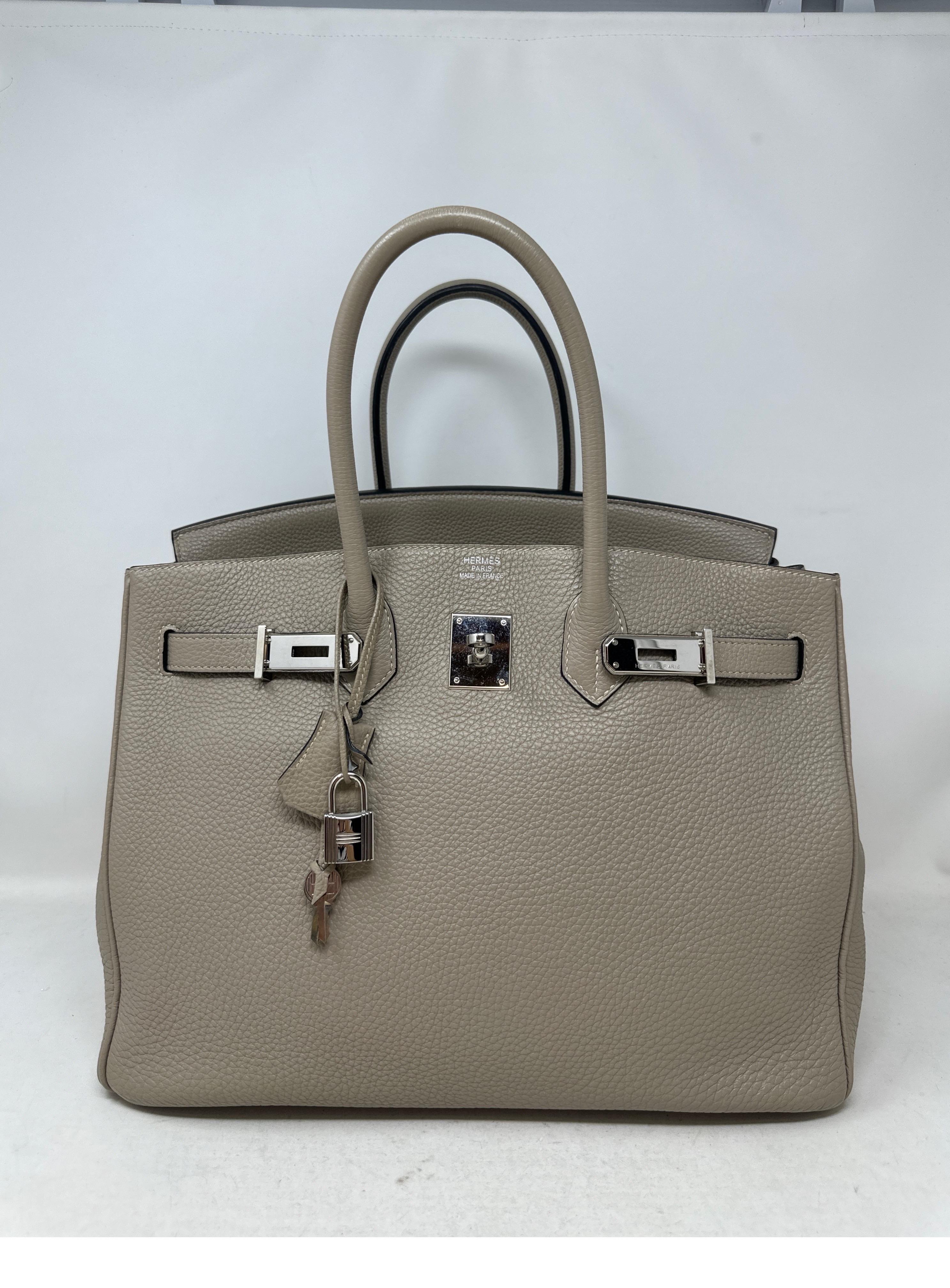 Hermes Gris Tourterelle Birkin 35 Bag. Light grey Birkin bag. Excellent condition. Palladium silver hardware. Togo leather. Interior clean. Great neutral color. Big bags are back in style. The 35 is the original classic size from Hermes. Includes