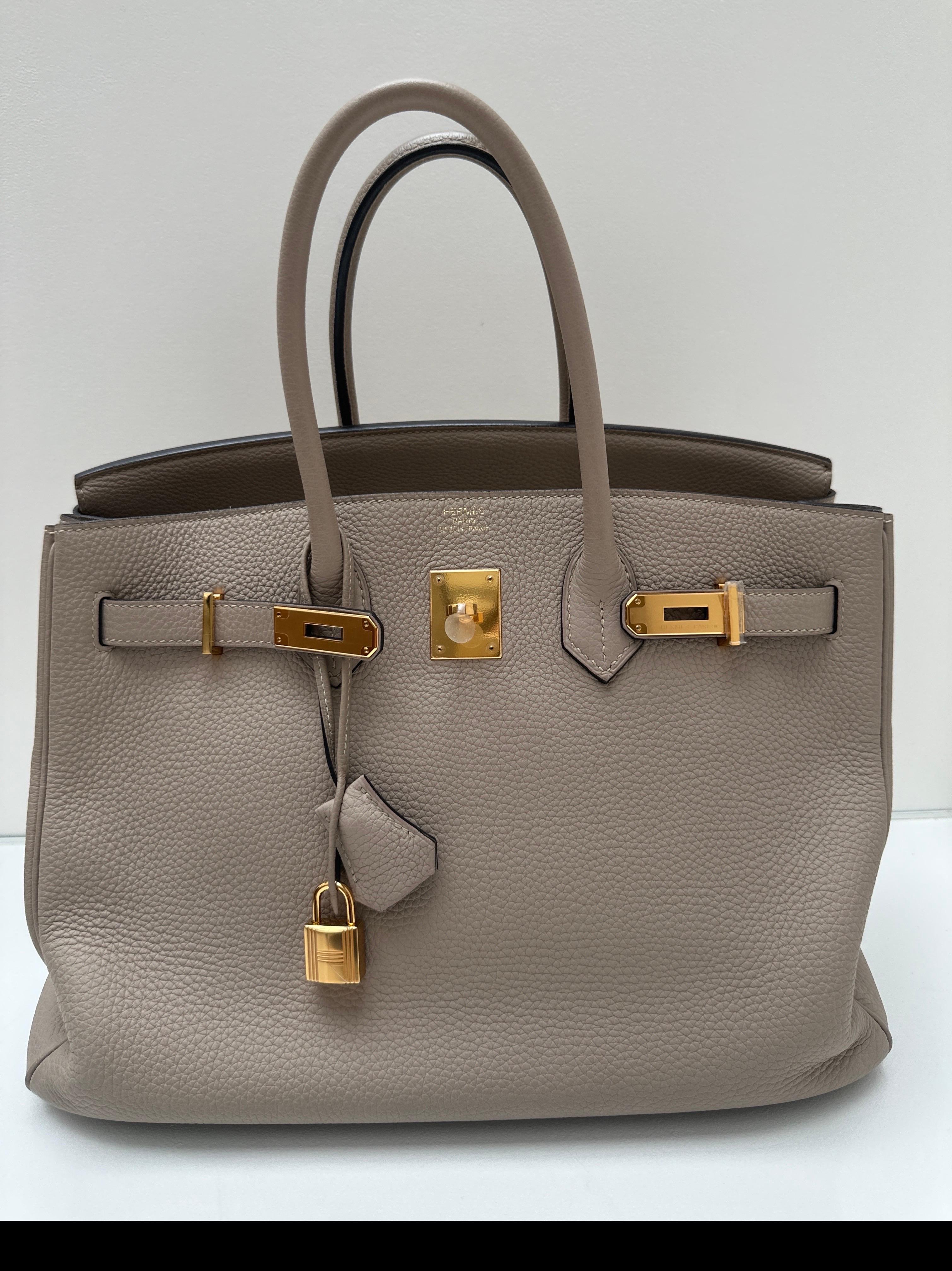 Hermes Gris Tourterelle Birlin 35 Bag. Gorgeous neutral color with gold hardware. Excellent condition. Interior clean. Plastic still on the hardware. Includes clochette, lock, keys, and dust bag. Guaranteed authentic. 