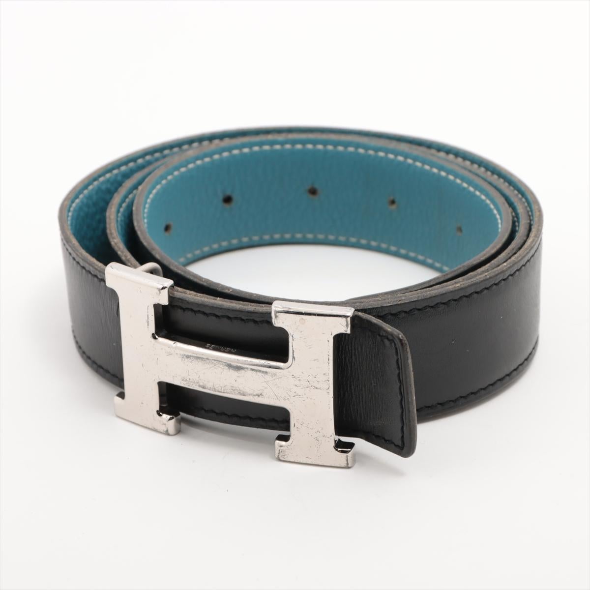 The Hermès H Reversible Belt in Black x Blue is a versatile and luxurious accessory that offers effortless style. Crafted from premium leather, this belt features the iconic 'H' buckle in polished palladium hardware, showcasing Hermès' timeless