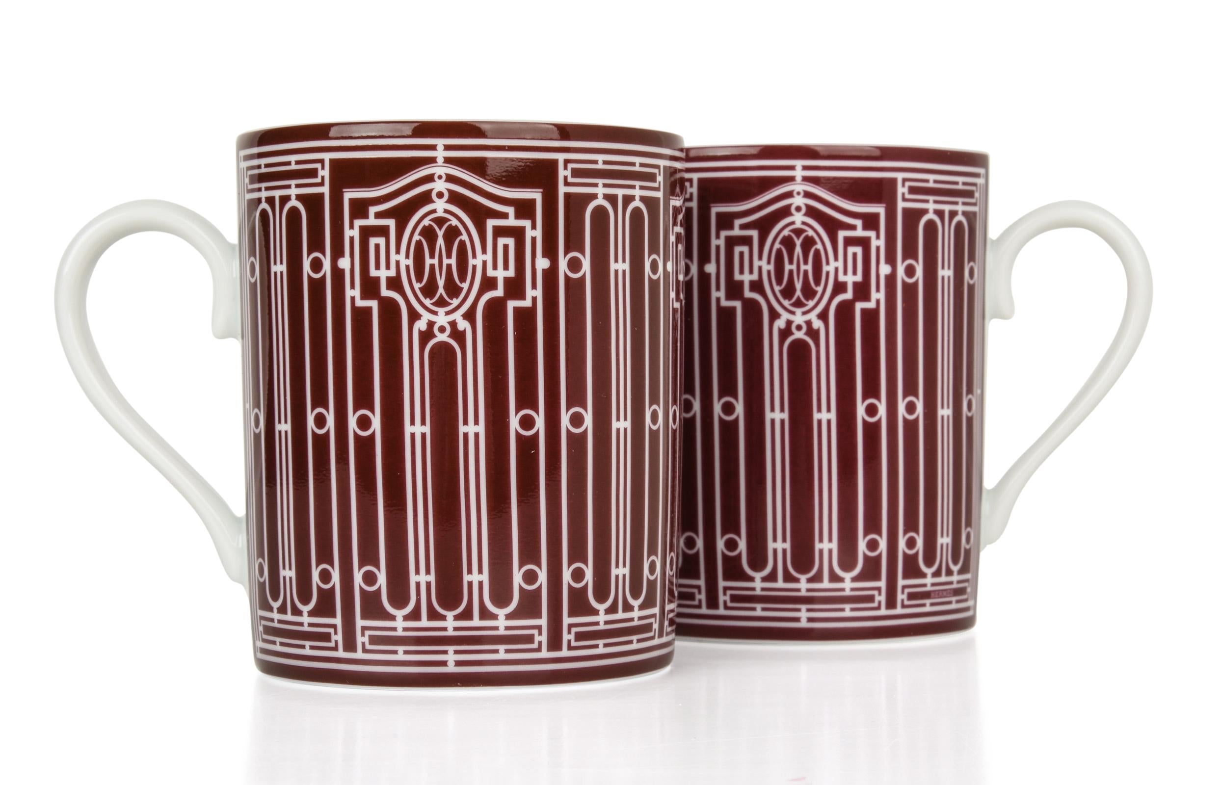 Guaranteed authentic pair of Hermes H Deco mugs featured in Rouge with white.
Features Art Deco wrought-iron friezes.
Each 10 oz mug is porcelain.
All are Deco themed in design.
Each mug comes with signature Hermes box and ribbon.
NEW or Pristine