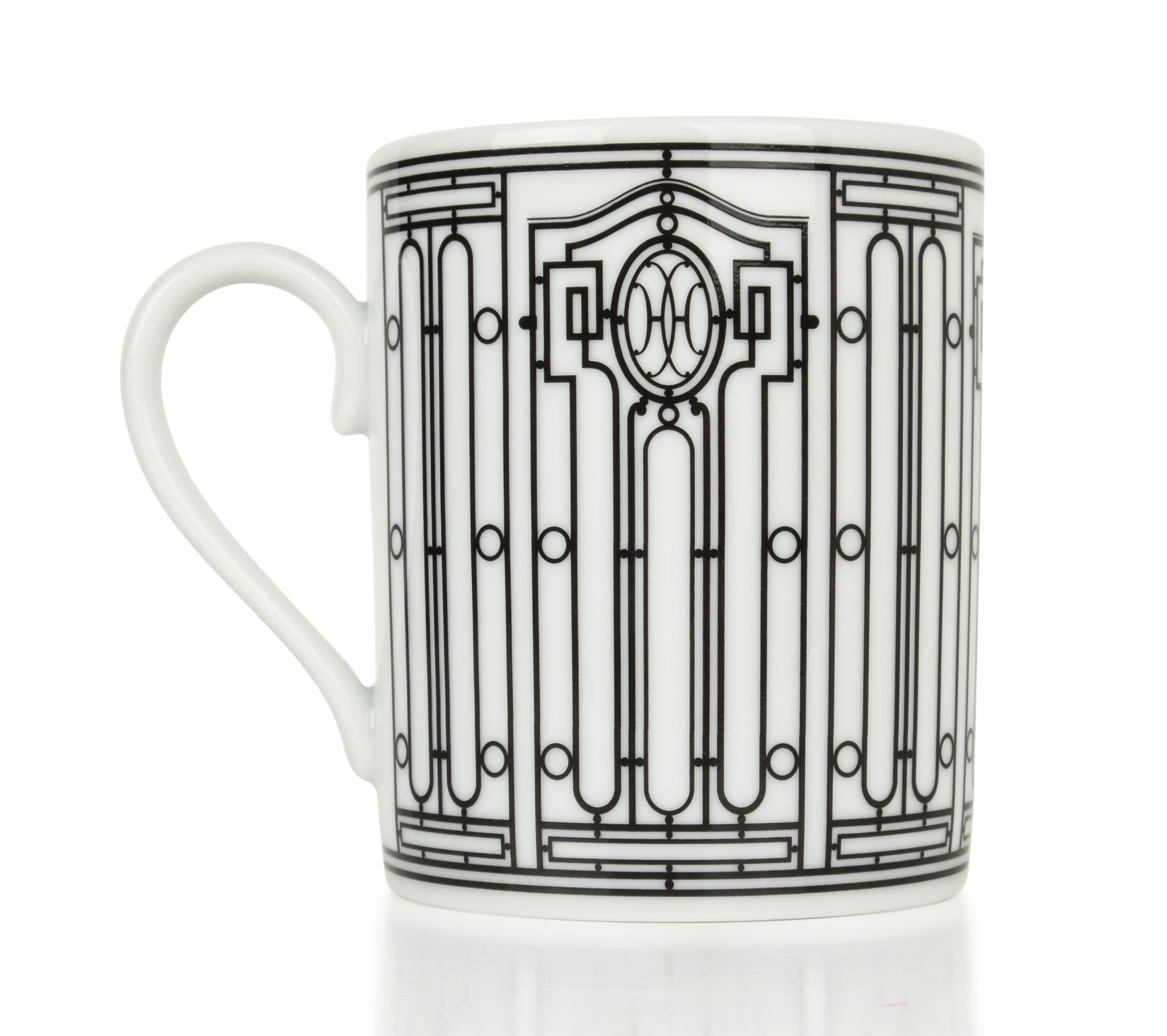 Guaranteed authentic set of four (4) Hermes H Deco mugs featured in white with black.
Features Art Deco wrought-iron friezes.
Each 10 oz mug is porcelain.
All are Deco themed in design.
Each mug comes with signature Hermes box and ribbon.
NEW or