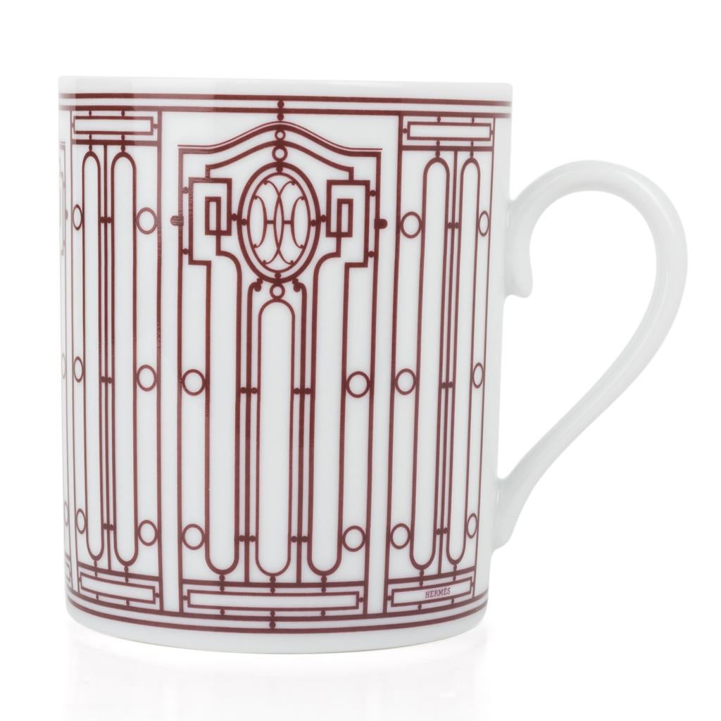 Guaranteed authentic pair of Hermes H Deco mugs featured in White with Rouge.
Features Art Deco wrought-iron friezes.
Each 10 oz mug is porcelain.
All are Deco themed in design.
Each mug comes with signature Hermes box and ribbon.
**Please note that