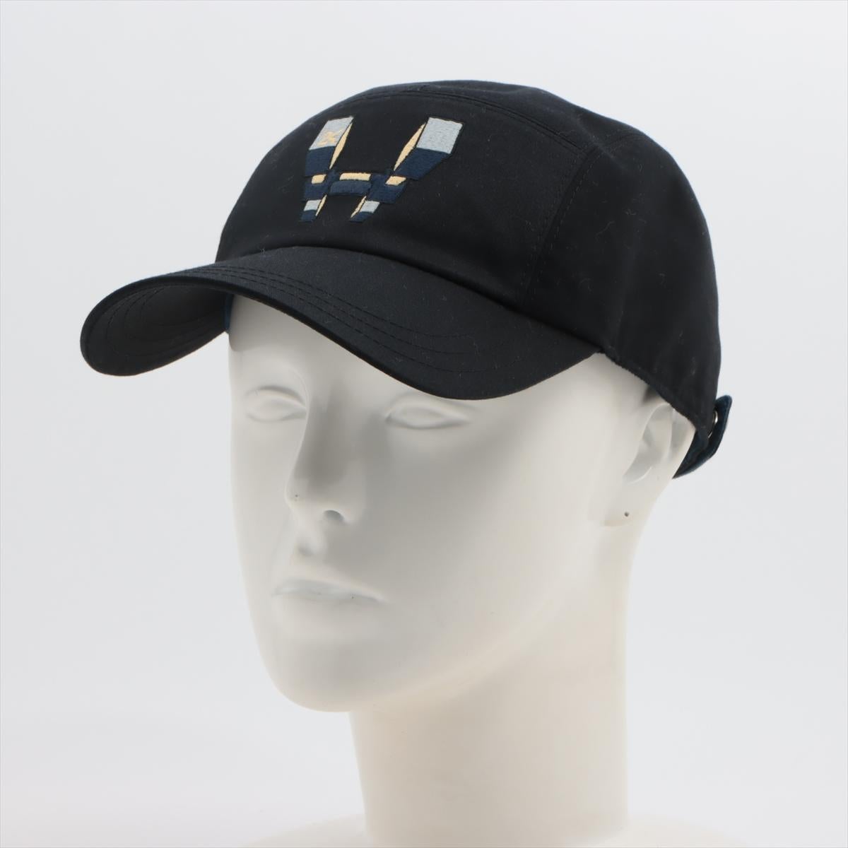 The Hermès H Embroidered Cap in black is a sophisticated accessory that blends casual style with refined elegance. Crafted from high-quality fabric, the cap features a classic silhouette with an adjustable strap for a personalized fit. The front is