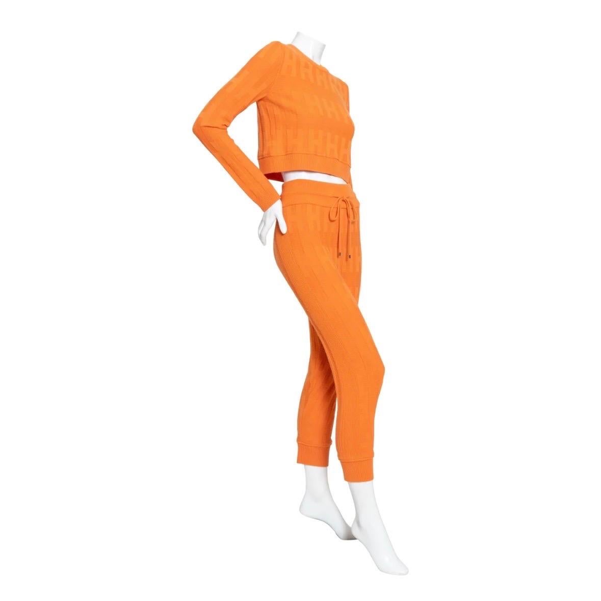 “H” Orange Terre Battue 2-piece Set by Hermès
Set includes “H” long-sleeve sweater and jogging pants 
Textured H-pattern knit
Made in Italy
Fabric: 100% virgin wool
Top:

Crewneck
Rib trimmed
Pull-over
Crop fit
Condition: excellent; minimal signs of