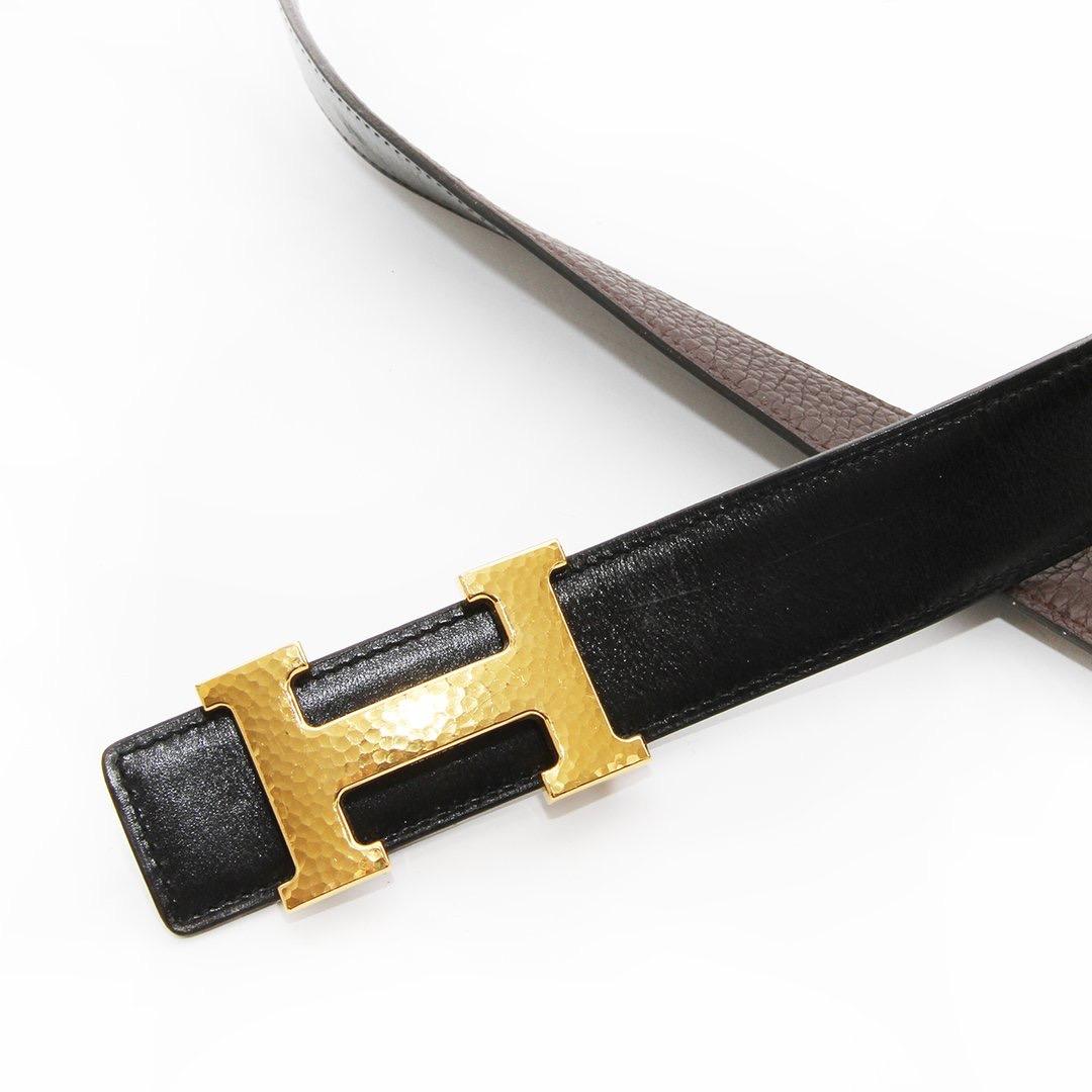 H belt by Hermes 
Circa 2011 
Reversible belt 
Black/Brown leather
Gold-tone hardware
Hammered H belt buckle 
Made in France
Condition: Excellent, light leatherwear to the belt. consistent with age and use. Some scratching on leather and hardware.