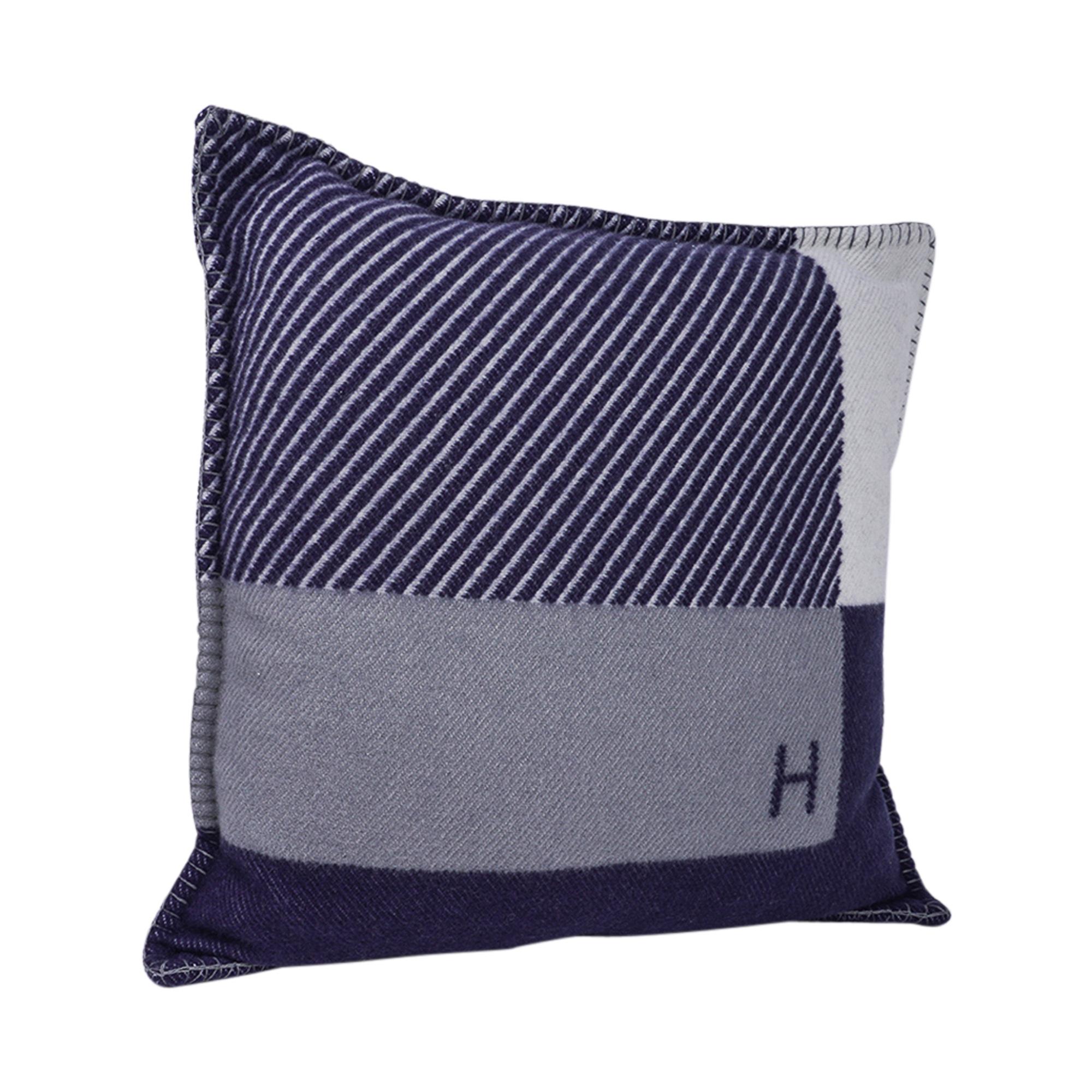 Mightychic offers an Hermes pillow H Riviera featured in Marine.
Designed by Hermes Studio the name invokes the beginning of sunbathing in the 1930s.
The removable cover is created from 90% Wool and 10% cashmere and has blanket stitch edges.
Comes