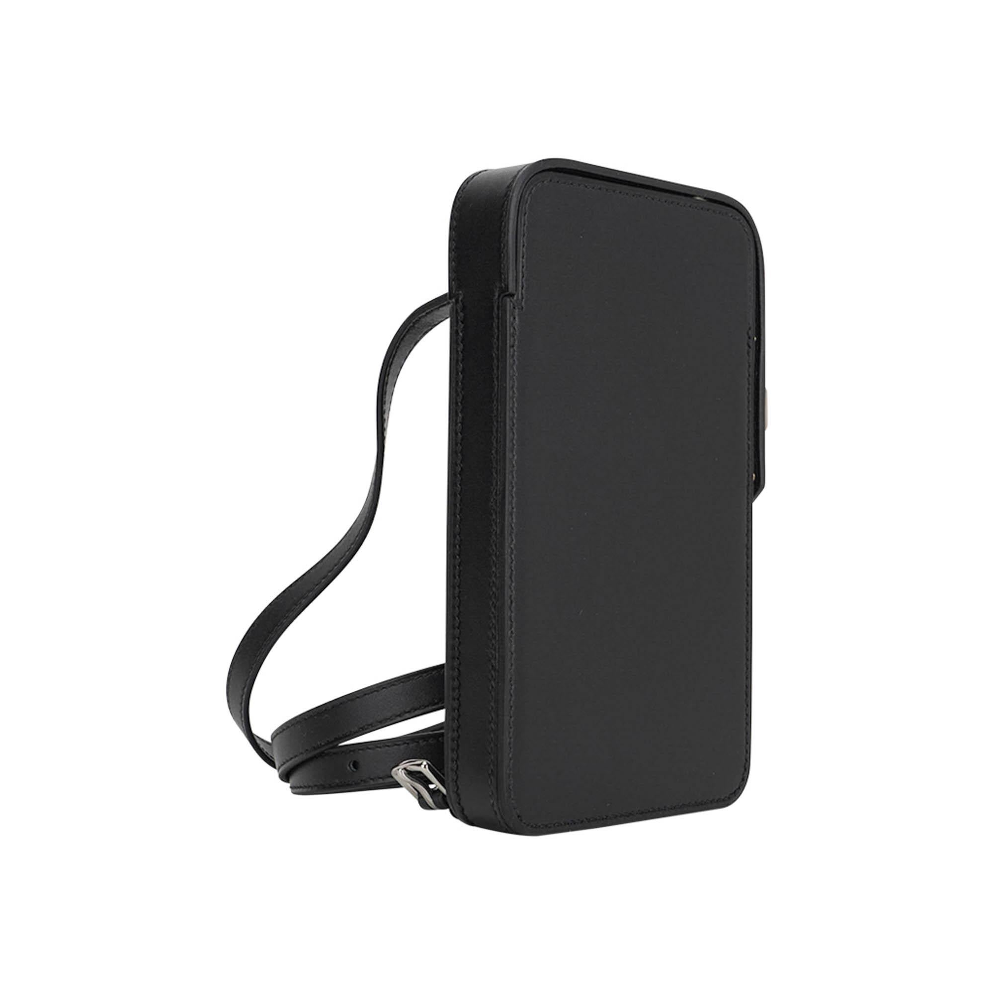 Mightychic offers a limited edition Hermes Hac a Box Phone Case featured in Black Tadelakt leather.
Crisp with Palladium hardware.
This very rare to find versatile case with adjustable strap can be carried on the shoulder or as crossbody.
With