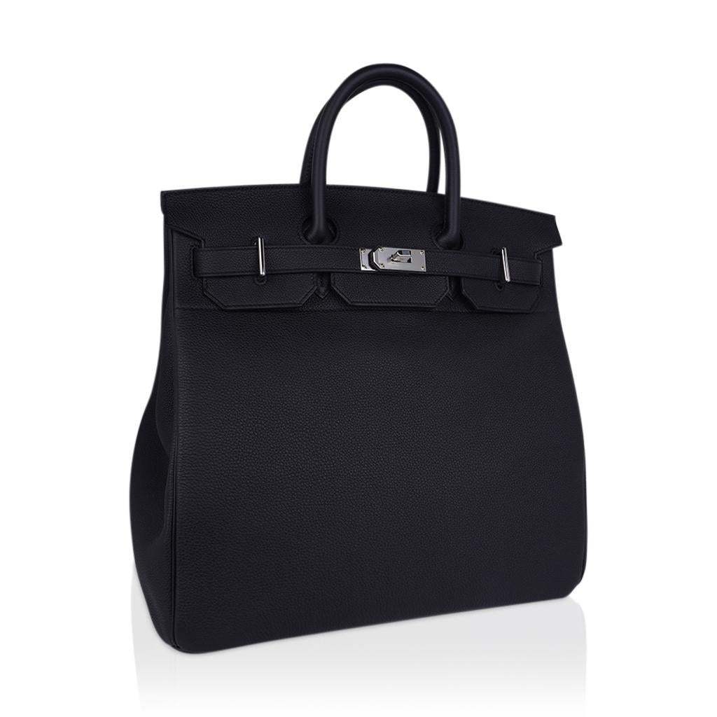 Mightychic offers an Hermes HAC 40 Birkin bag featured in Black.
Fresh and striking with Palladium hardware.
Beautifully grained Togo leather which is very scratch resistant.
Comes with lock, keys and clochette, sleeper, and signature Hermes orange